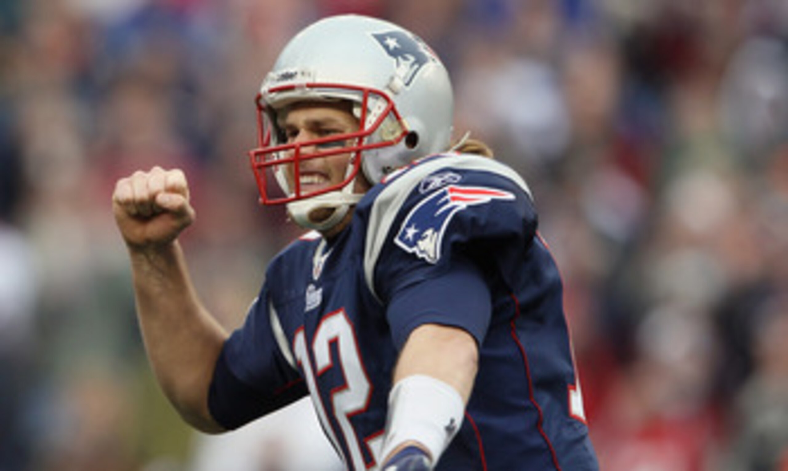 FOXBORO, MA - JANUARY 02:  Tom Brady #12 of the New England Patriots celebrates a touchdown by teammate BenJarvis Green-Ellis in the first quarter against the Miami Dolphins on January 2, 2011 at Gillette Stadium in Foxboro, Massachusetts.  (Photo by Elsa