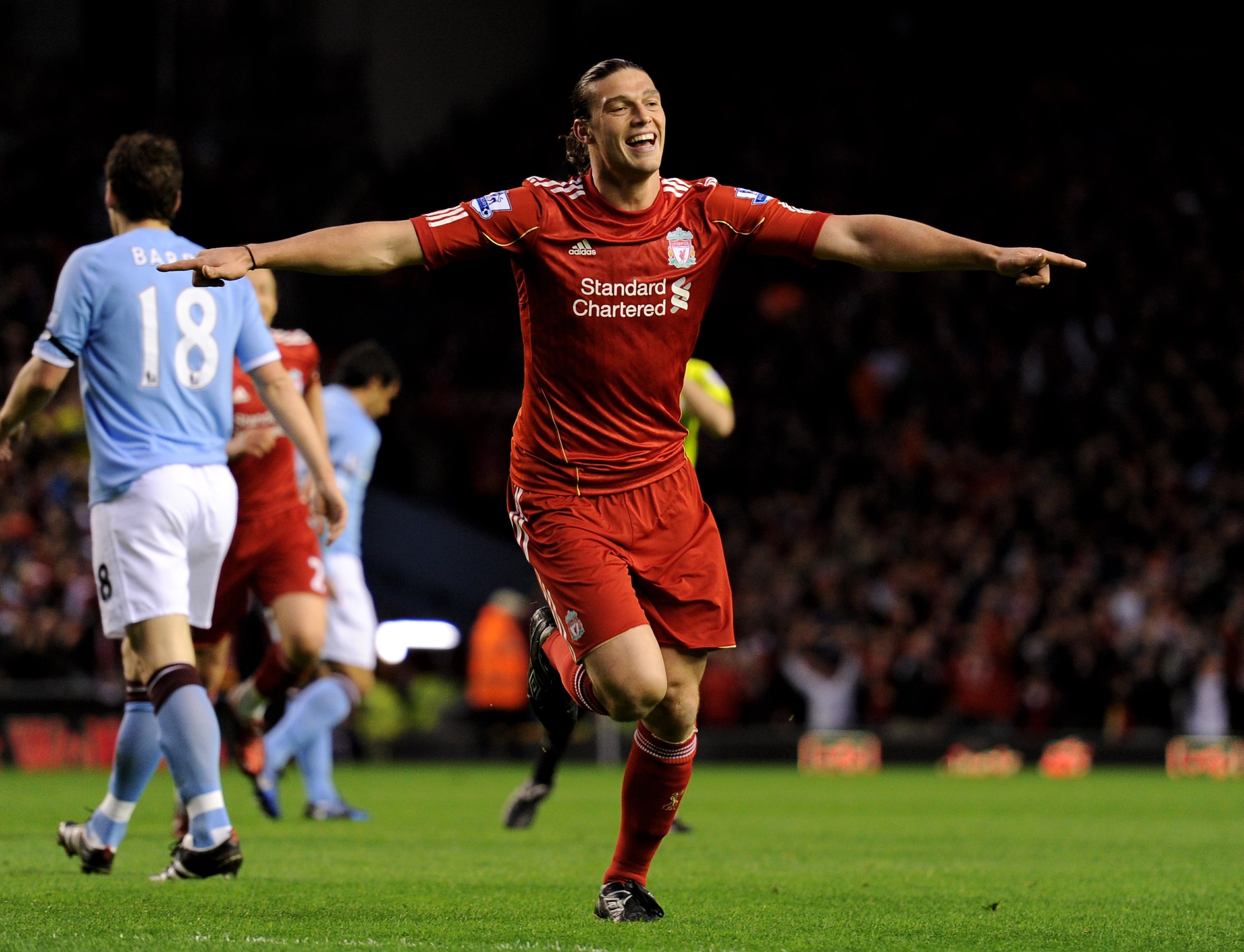 LIVERPOOL, ENGLAND - APRIL 11:  Andy Carroll of Liverpool celebrates scoring the opening goal during the Barclays Premier League match between Liverpool and Manchester City at Anfield on April 11, 2011 in Liverpool, England.  (Photo by Michael Regan/Getty