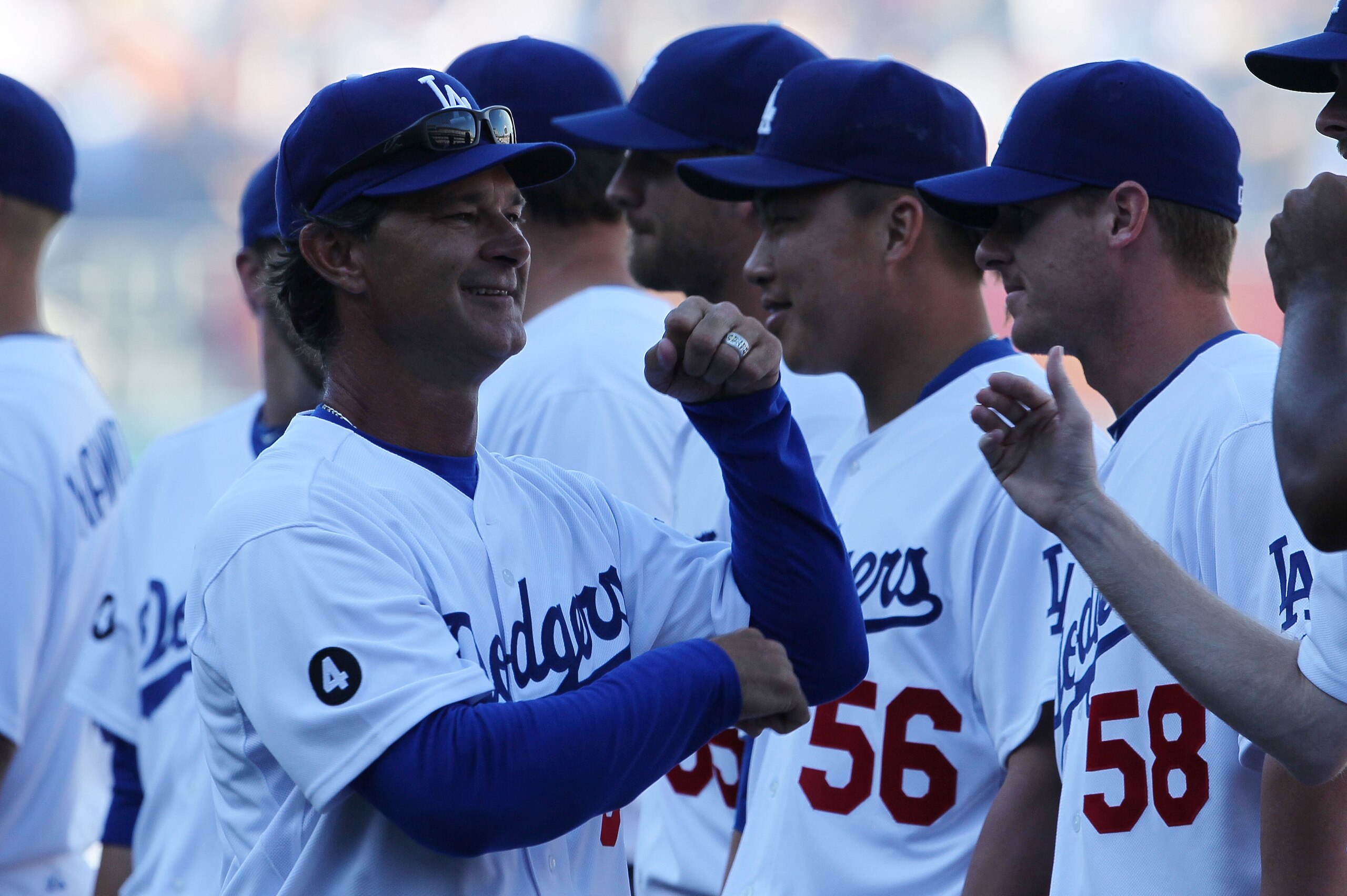 LOS ANGELES, CA - MARCH 31: Manager Don Mattingly #8 of the Los Angeles Dodgers greets his team during introductions prior to playing the San Francisco Giants on Opening Day at Dodger Stadium on March 31, 2011 in Los Angeles, California. (Photo by Jeff LOS ANGELES, CA - MARCH 31: Manager Don Mattingly #8 of the Los Angeles Dodgers greets his team during introductions prior to playing the San Francisco Giants on Opening Day at Dodger Stadium on March 31, 2011 in Los Angeles, California. (Photo by Jeff