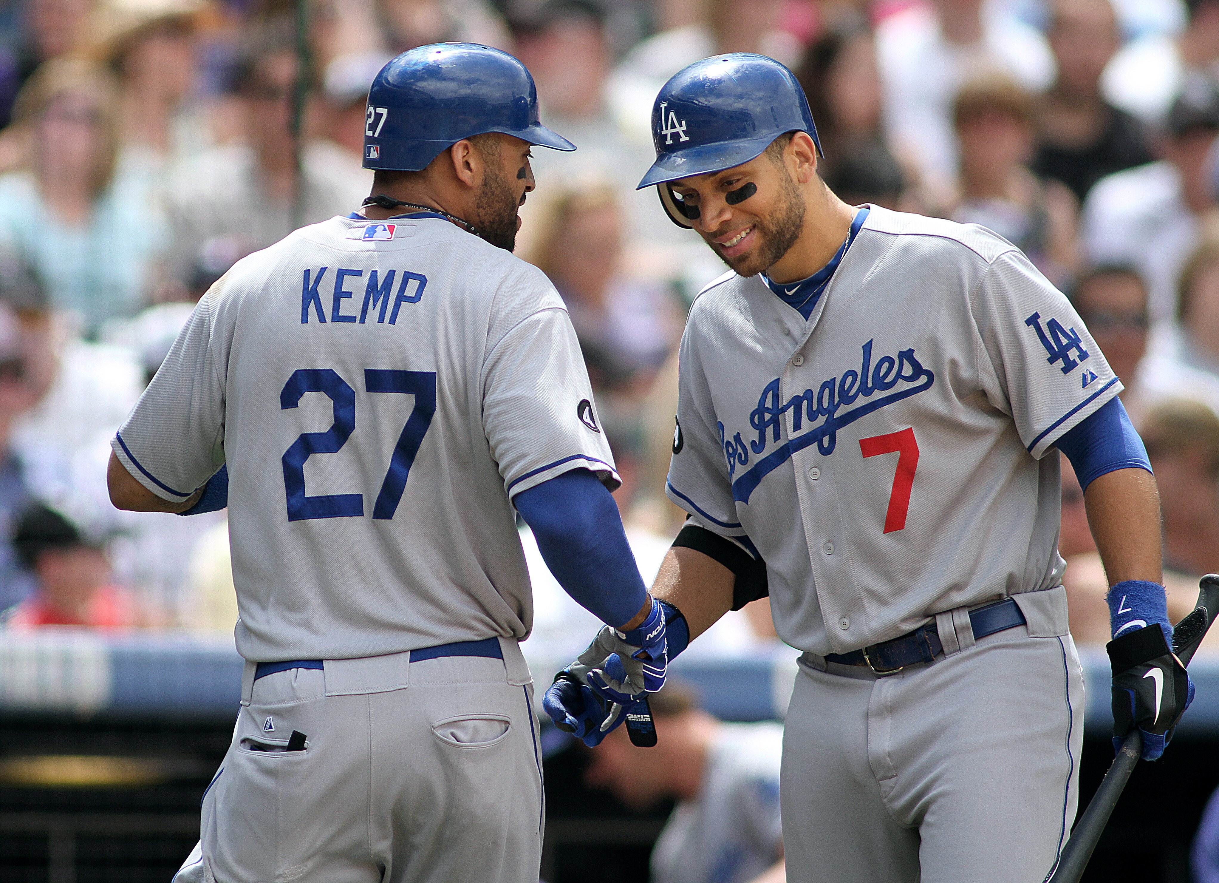 DENVER, CO - JUNE 12: Matt Kemp #27 of the Los Angeles Dodgers celebrates a solo home run in the fifth inning with teammate James Loney #7 against the Colorado Rockies on June 12, 2011 at Coors Field in Denver, Colorado. The Dodgers won the game 10-8. (Ph