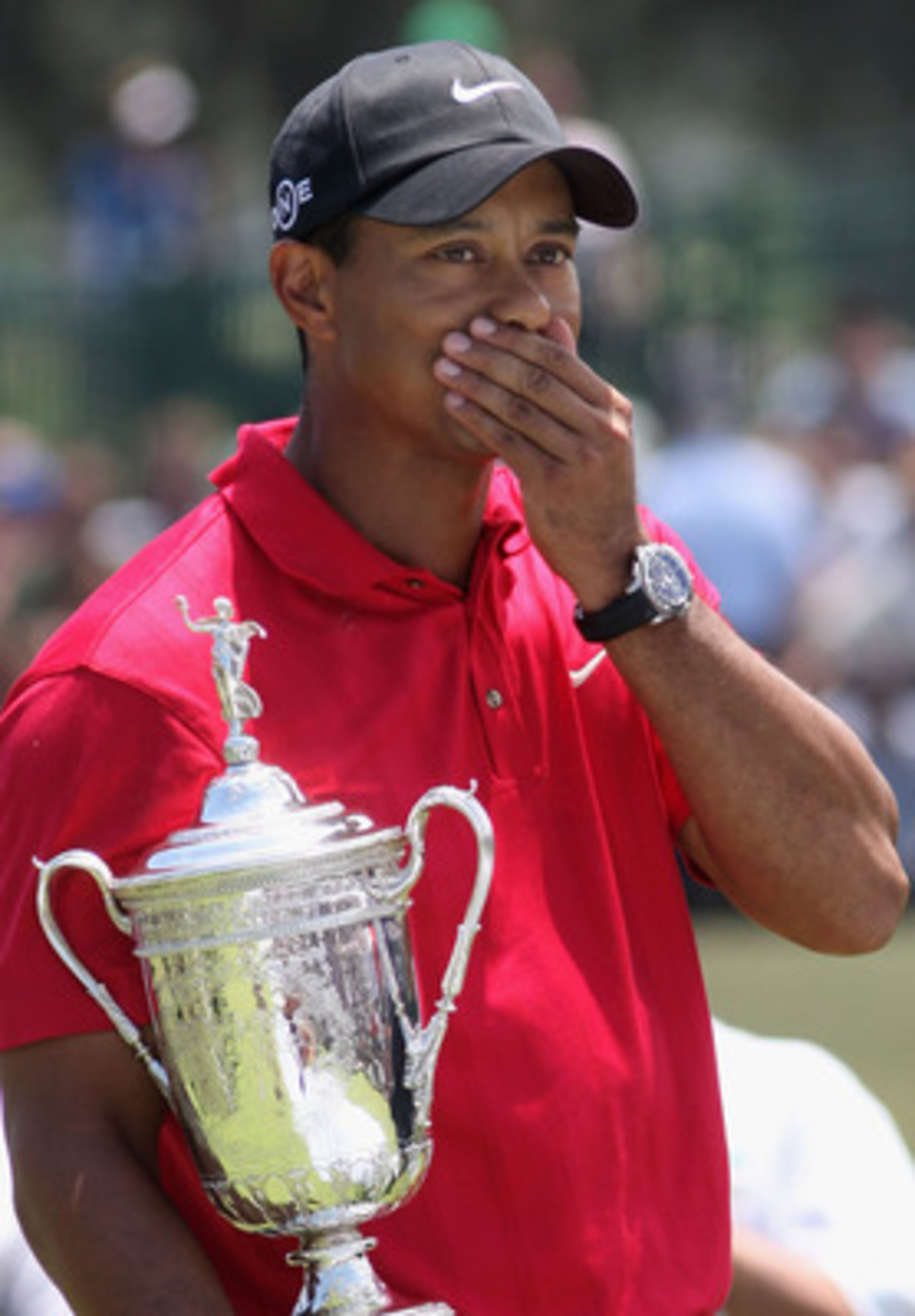 SAN DIEGO - JUNE 16:  Tiger Woods celebrates with the trophy after winning on the first sudden death playoff hole during the playoff round of the 108th U.S. Open at the Torrey Pines Golf Course (South Course) on June 16, 2008 in San Diego, California.  (P