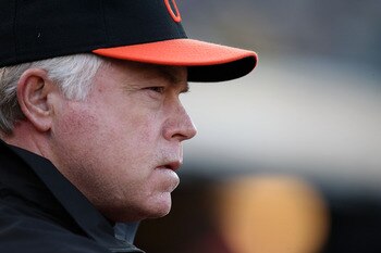 OAKLAND, CA - MAY 27:  Manager Buck Showalter of the Baltimore Orioles looks on against the Oakland Athletics during a Major League Baseball game at the Oakland-Alameda County Coliseum on May 27, 2011 in Oakland, California.  (Photo by Jed Jacobsohn/Getty