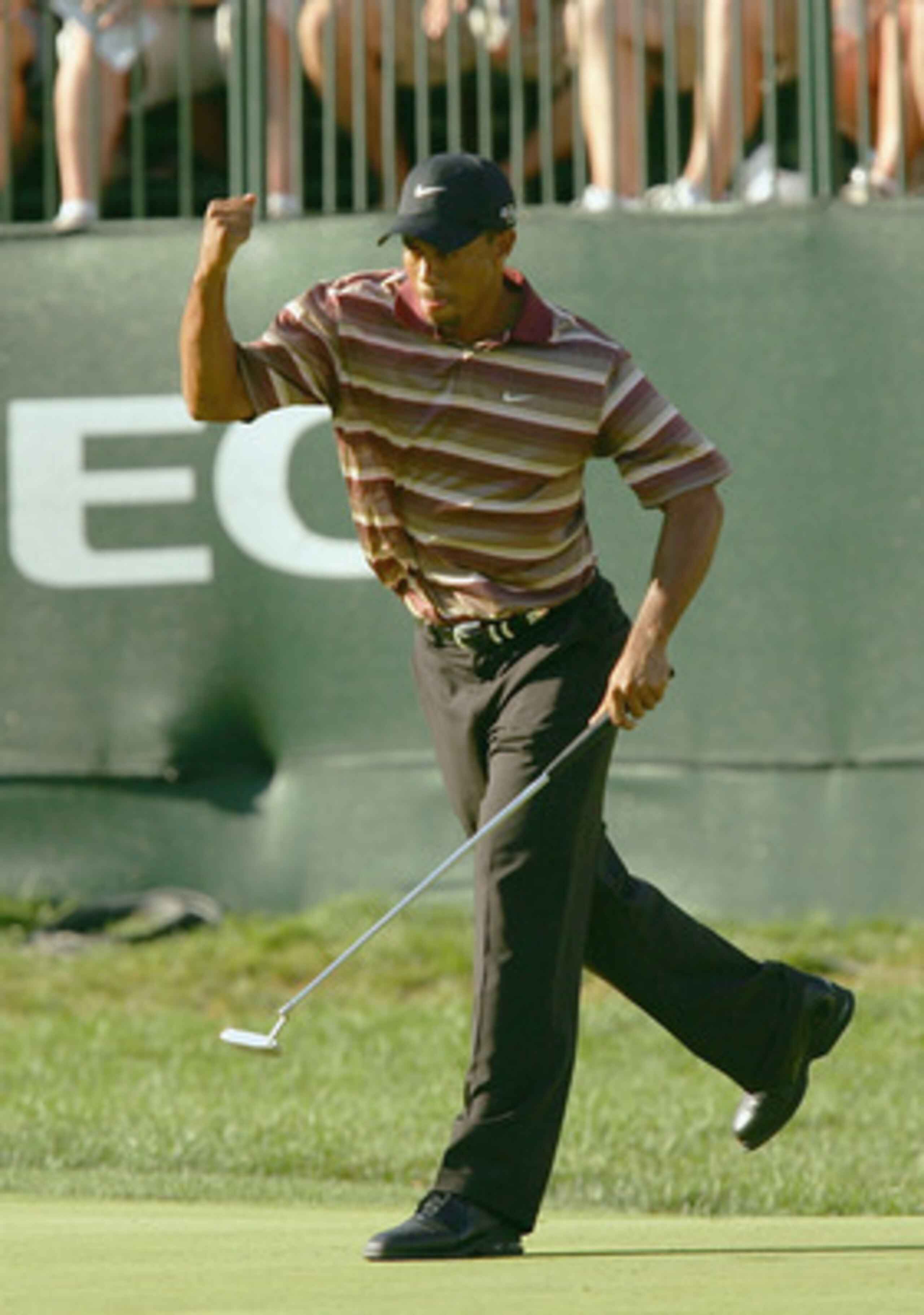 AKRON, OH - AUGUST 21:  Tiger Woods pumps his fists in celebration of a birdie on the 16th hole to put him at 6 under par and in the lead during the fourth round of the NEC Invitational at the Firestone Country Club on August 21, 2005 in Akron, Ohio.  Woo