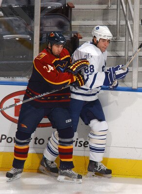 ATLANTA - DECEMBER 1:  Shane Hnidy #34 of the Atlanta Thrashers skates against Eric Lindros #88 of the Toronto Maple Leafs at Philips Arena on December 1, 2005 in Atlanta, Georgia. The Maple Leafs won 4-1. (Photo by: Scott Cunningham/Getty Images)