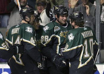 DALLAS - NOVEMBER 01:  Center Eric Lindros #88 of the Dallas Stars celebrates a goal with Brenden Morrow #10 during play against the St. Louis Blues at the American Airlines Center on November 1, 2006 in Dallas, Texas.  (Photo by Ronald Martinez/Getty Ima