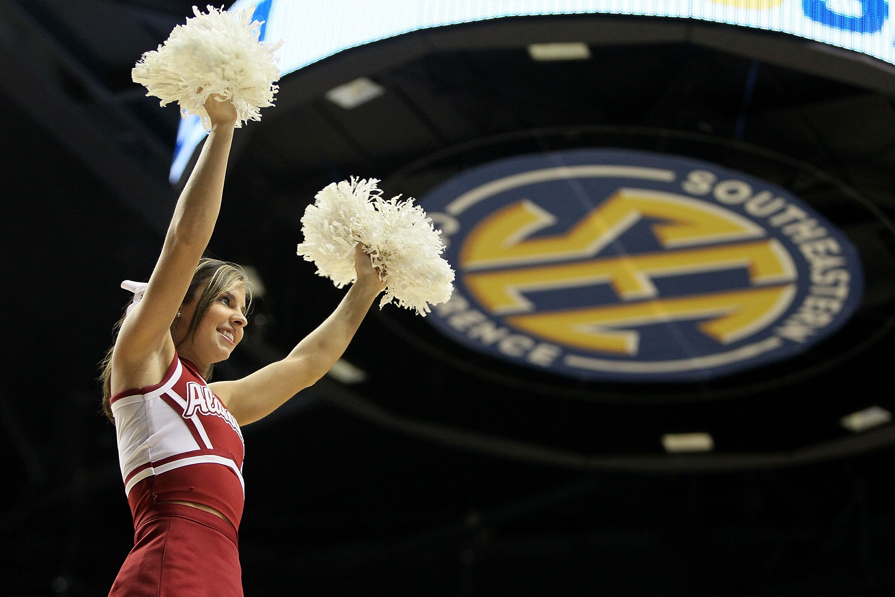 NASHVILLE, TN - MARCH 11: A cheerleader for the Alabama Crimson Tide performs against the South Carolina Gamecocks during the first round of the SEC Men's Basketball Tournament at the Bridgestone Arena on March 11, 2010 in Nashville, Tennessee.  (Photo by