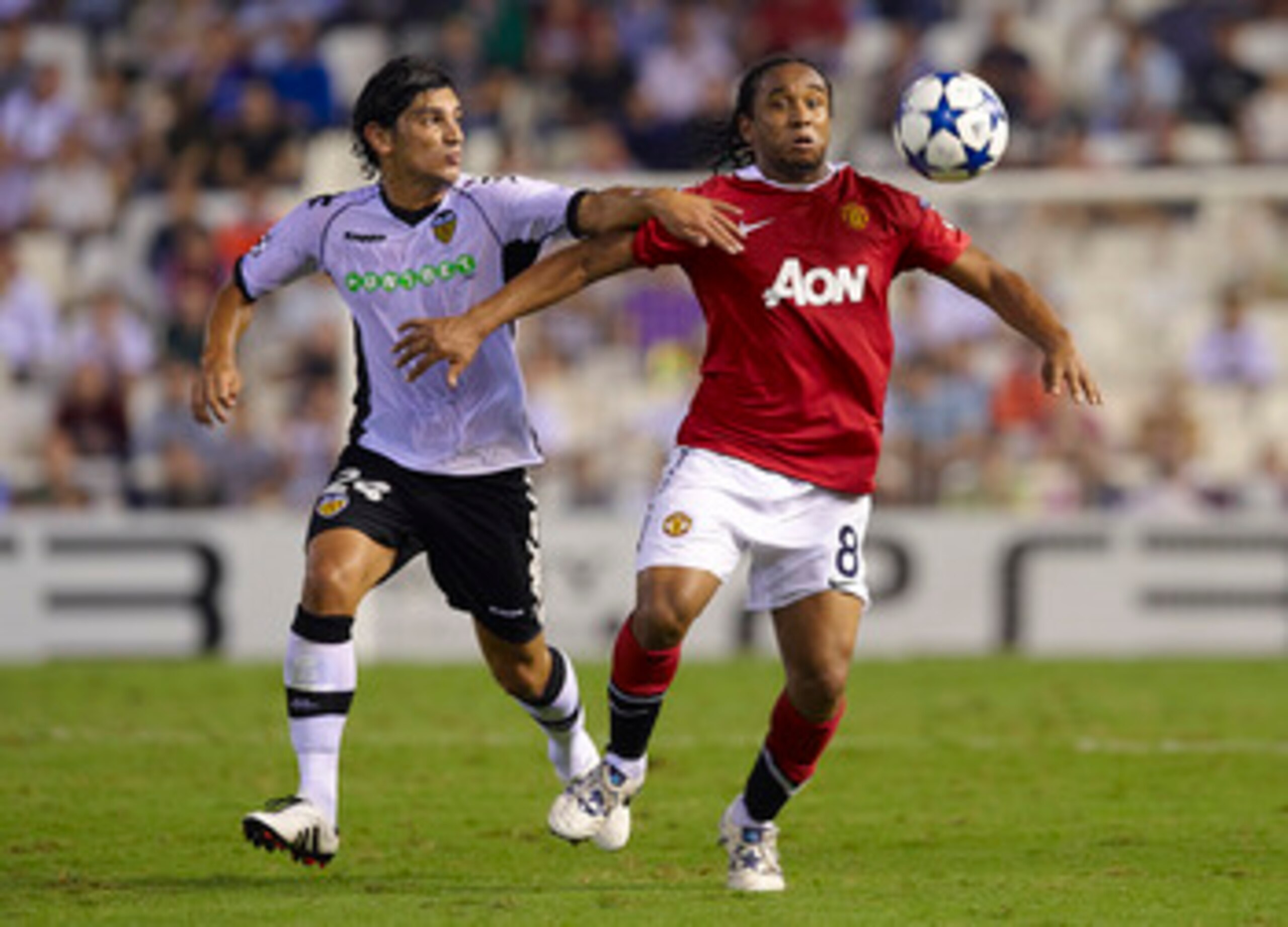 VALENCIA, SPAIN - SEPTEMBER 29: Tino Costa (L) of Valencia duels for the ball with Anderson of Manchester United during the UEFA Champions League group C match between Valencia and Manchester United on September 29, 2010 in Valencia, Spain. (Photo by Ma VALENCIA, SPAIN - SEPTEMBER 29: Tino Costa (L) of Valencia duels for the ball with Anderson of Manchester United during the UEFA Champions League group C match between Valencia and Manchester United on September 29, 2010 in Valencia, Spain. (Photo by Ma