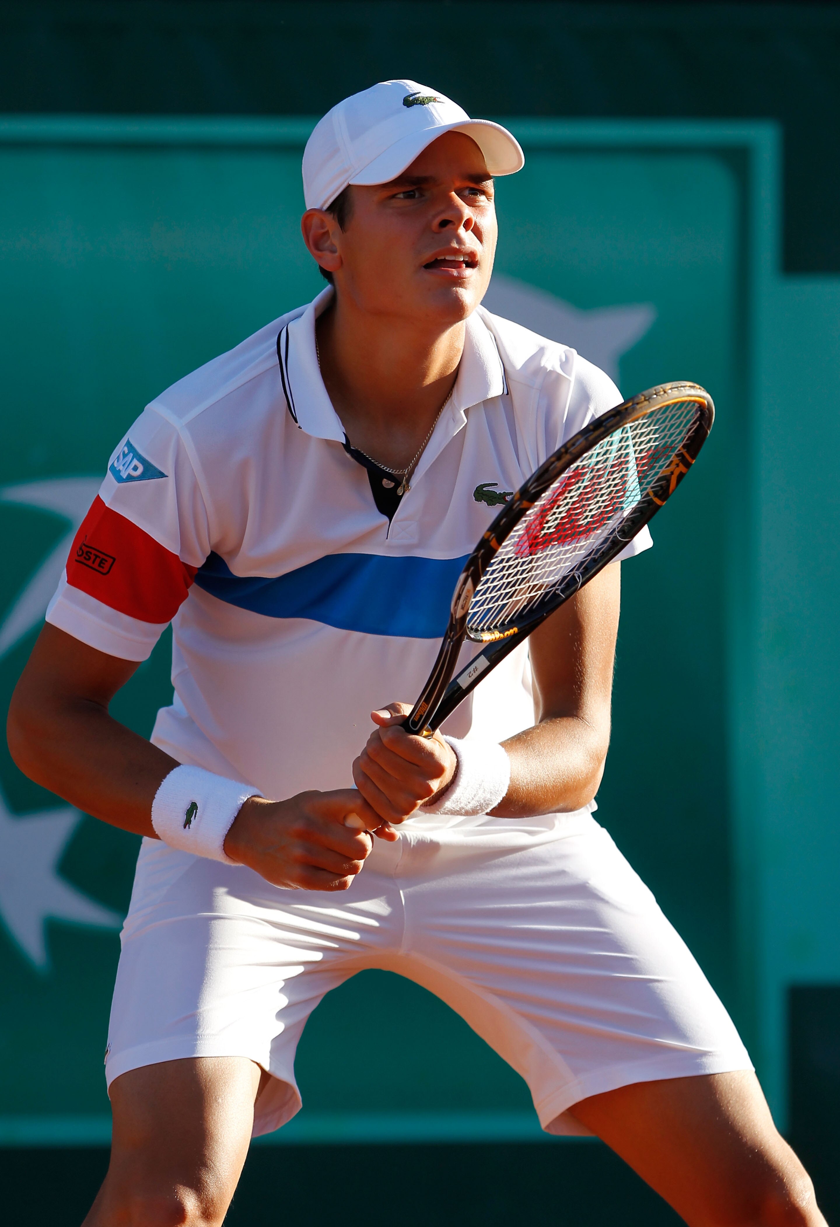 PARIS, FRANCE - MAY 23:  Milos Raonic of Canada prepares to receive a serve during the men's singles first round match between Michael Berrer of Germany and Milos Raonic of Canada on day two of the French Open at Roland Garros on May 23, 2011 in Paris, Fr