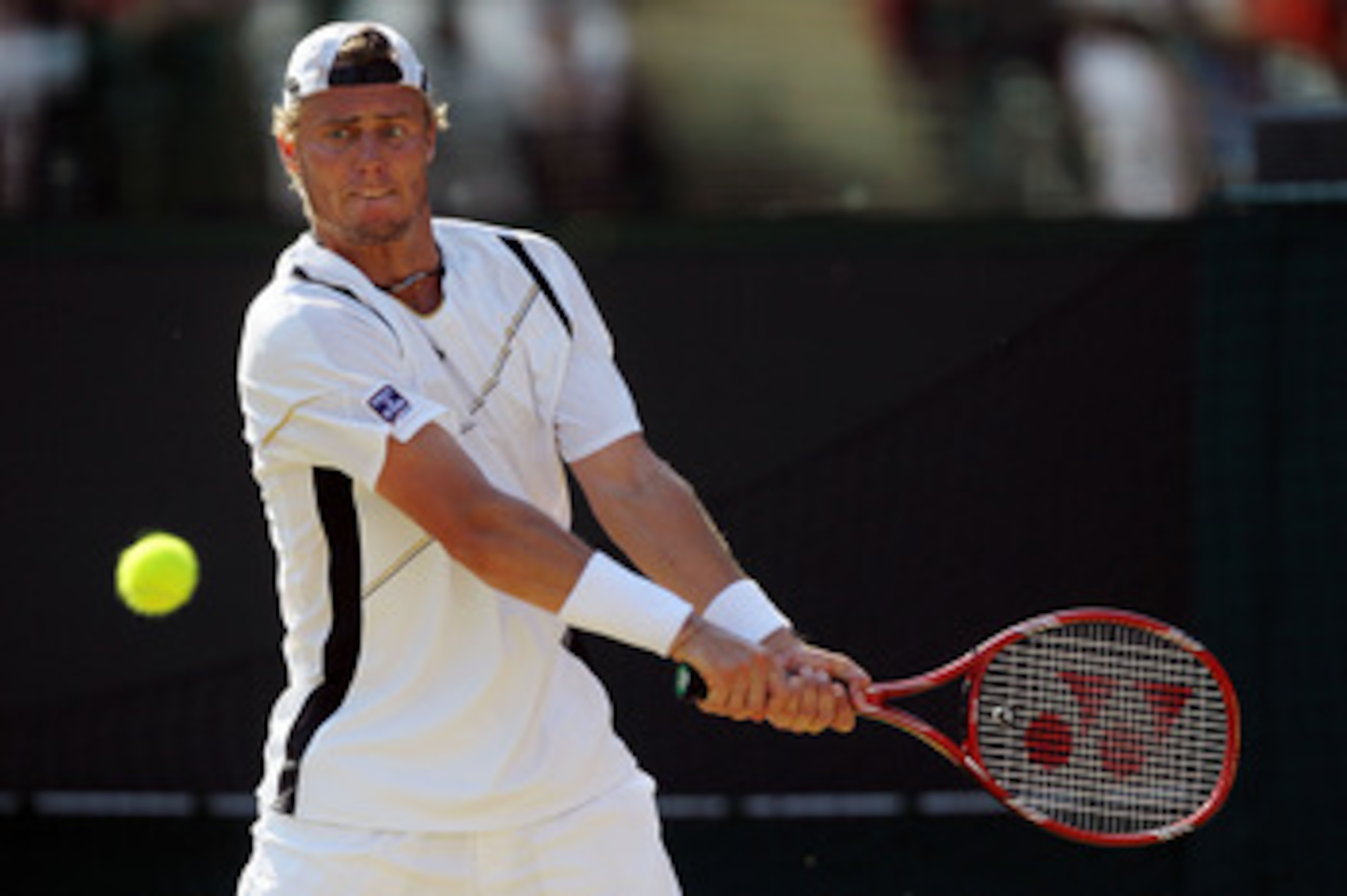 LONDON, ENGLAND - JUNE 28:  Lleyton Hewitt of Australia in action during his match against Novak Djokovic of Serbia on Day Seven of the Wimbledon Lawn Tennis Championships at the All England Lawn Tennis and Croquet Club on June 28, 2010 in London, England