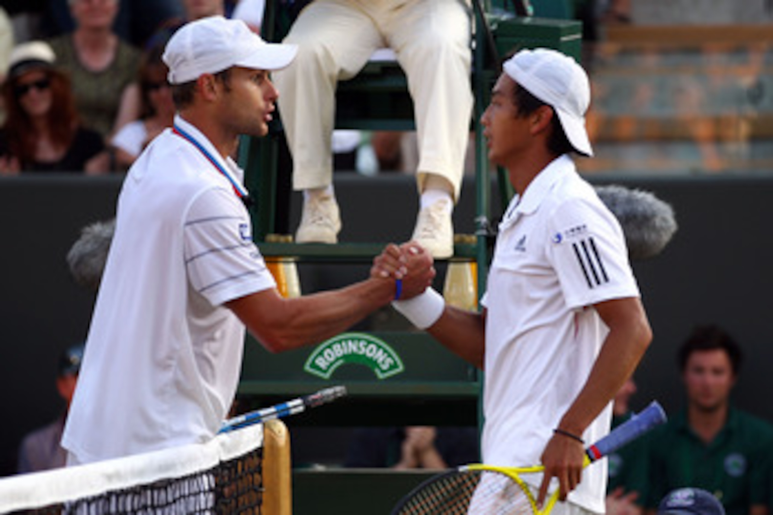 LONDON, ENGLAND - JUNE 28:  Yen-Hsun Lu of Taipei greets Andy Roddick of USA after defeating him on Day Seven of the Wimbledon Lawn Tennis Championships at the All England Lawn Tennis and Croquet Club on June 28, 2010 in London, England.  (Photo by Clive 