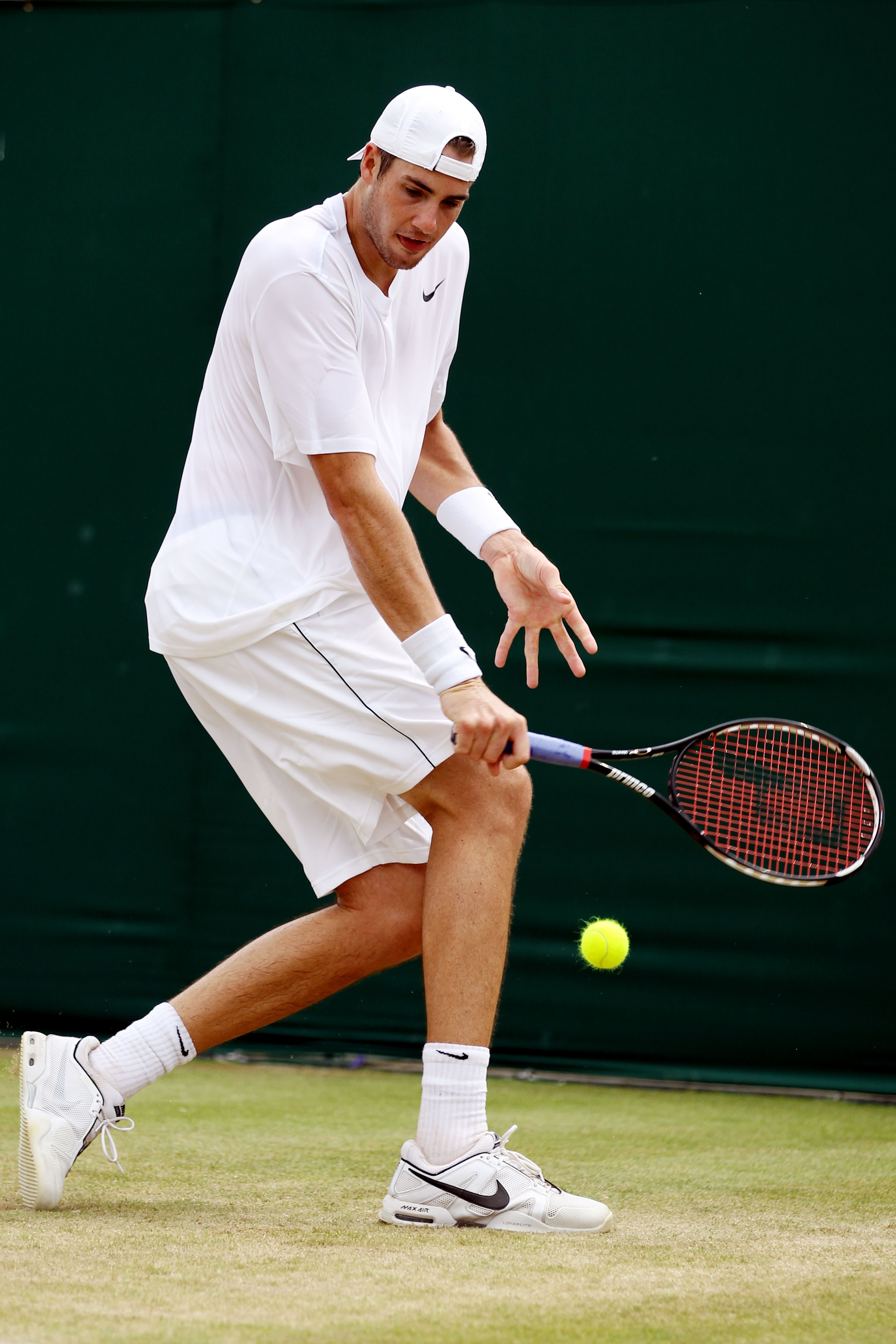 LONDON, ENGLAND - JUNE 25: John Isner of USA in action during his match against Thiemo De Bakker of Netherlands on Day Five of the Wimbledon Lawn Tennis Championships at the All England Lawn Tennis and Croquet Club on June 25, 2010 in London, England. ( LONDON, ENGLAND - JUNE 25: John Isner of USA in action during his match against Thiemo De Bakker of Netherlands on Day Five of the Wimbledon Lawn Tennis Championships at the All England Lawn Tennis and Croquet Club on June 25, 2010 in London, England. (