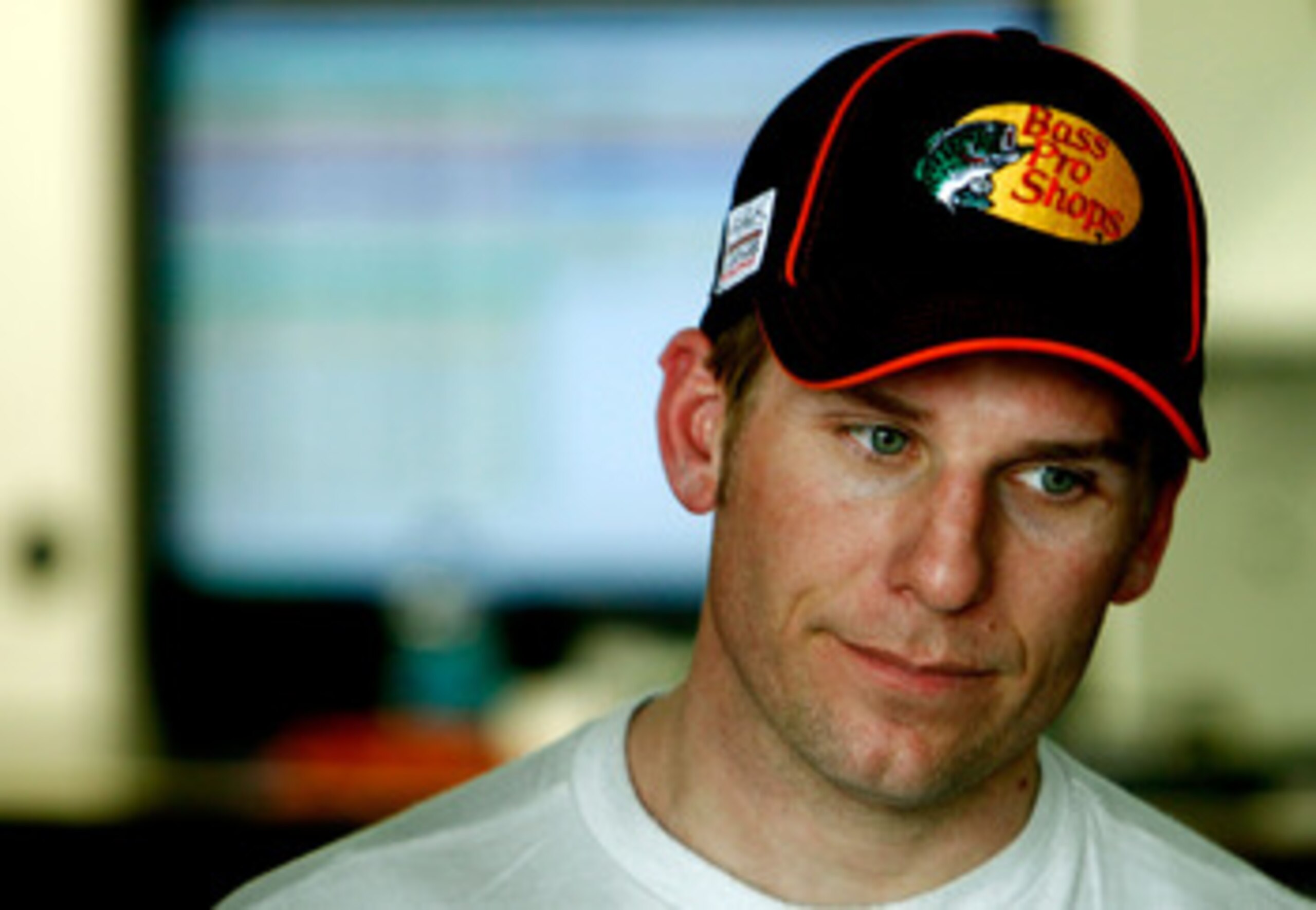 TALLADEGA, AL - APRIL 15:  Jamie McMurray, driver of the #1 Bass Pro Shops/Tracker Boats Chevrolet,  stands in the garage during practice for the NASCAR Sprint Cup Series Aaron's 499 at Talladega Superspeedway on April 15, 2011 in Talladega, Alabama.  (Ph