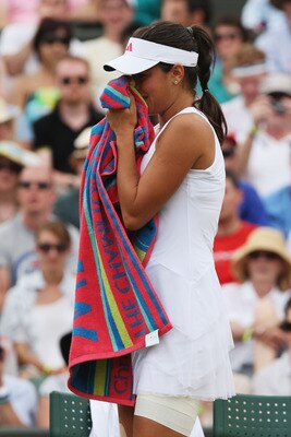 WIMBLEDON, ENGLAND - JUNE 29:  Ana Ivanovic of Serbia shows her emotions as she retires through injury during the women's singles fourth round match against Venus Williams of USA on Day Seven of the Wimbledon Lawn Tennis Championships at the All England L