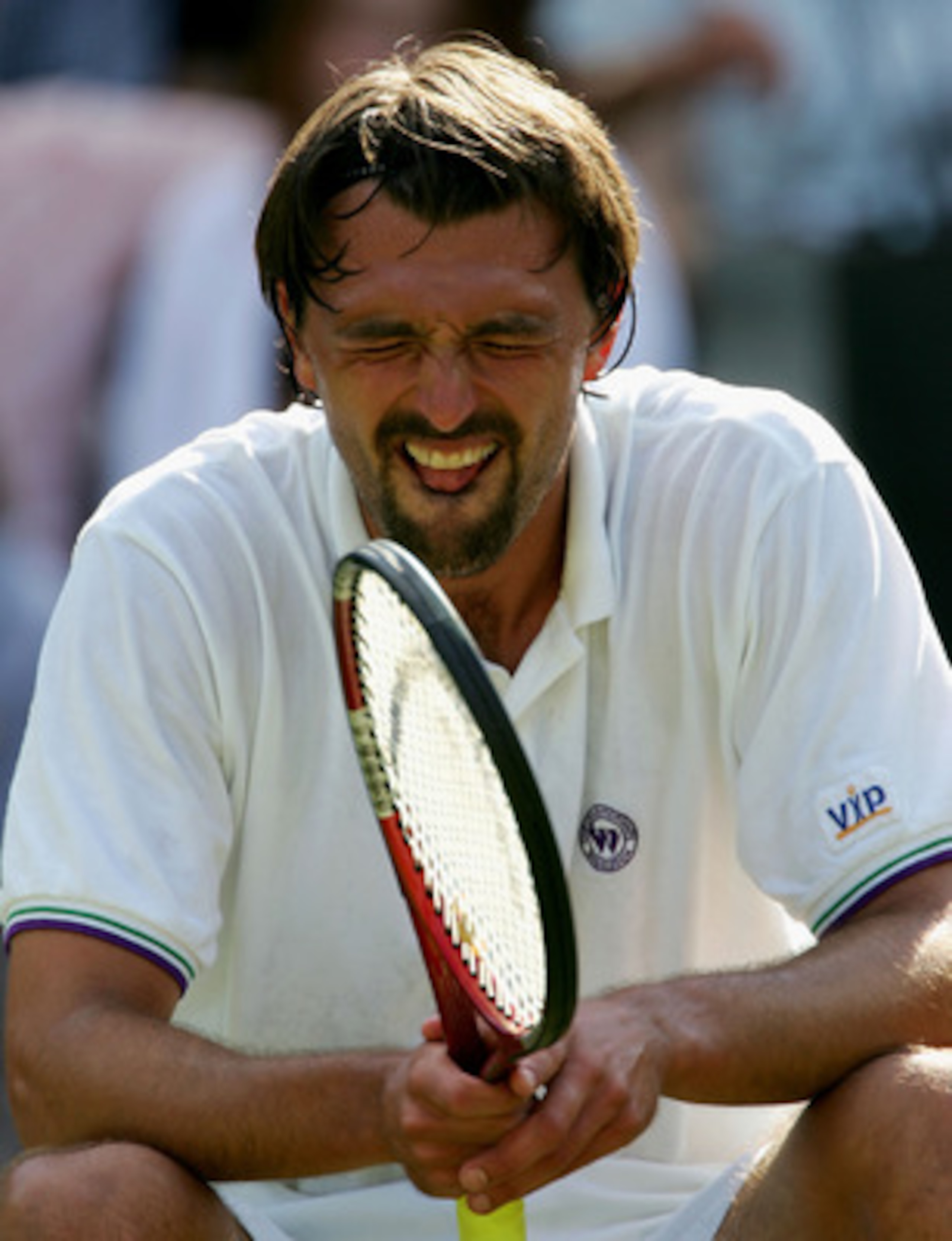 LONDON - JUNE 25: Goran Ivanisevic of Croatia reacts during his third round match defeat against Lleyton Hewitt of Australia at the Wimbledon Lawn Tennis Championship on June 25, 2004 at the All England Lawn Tennis and Croquet Club in London.  (Photo by C