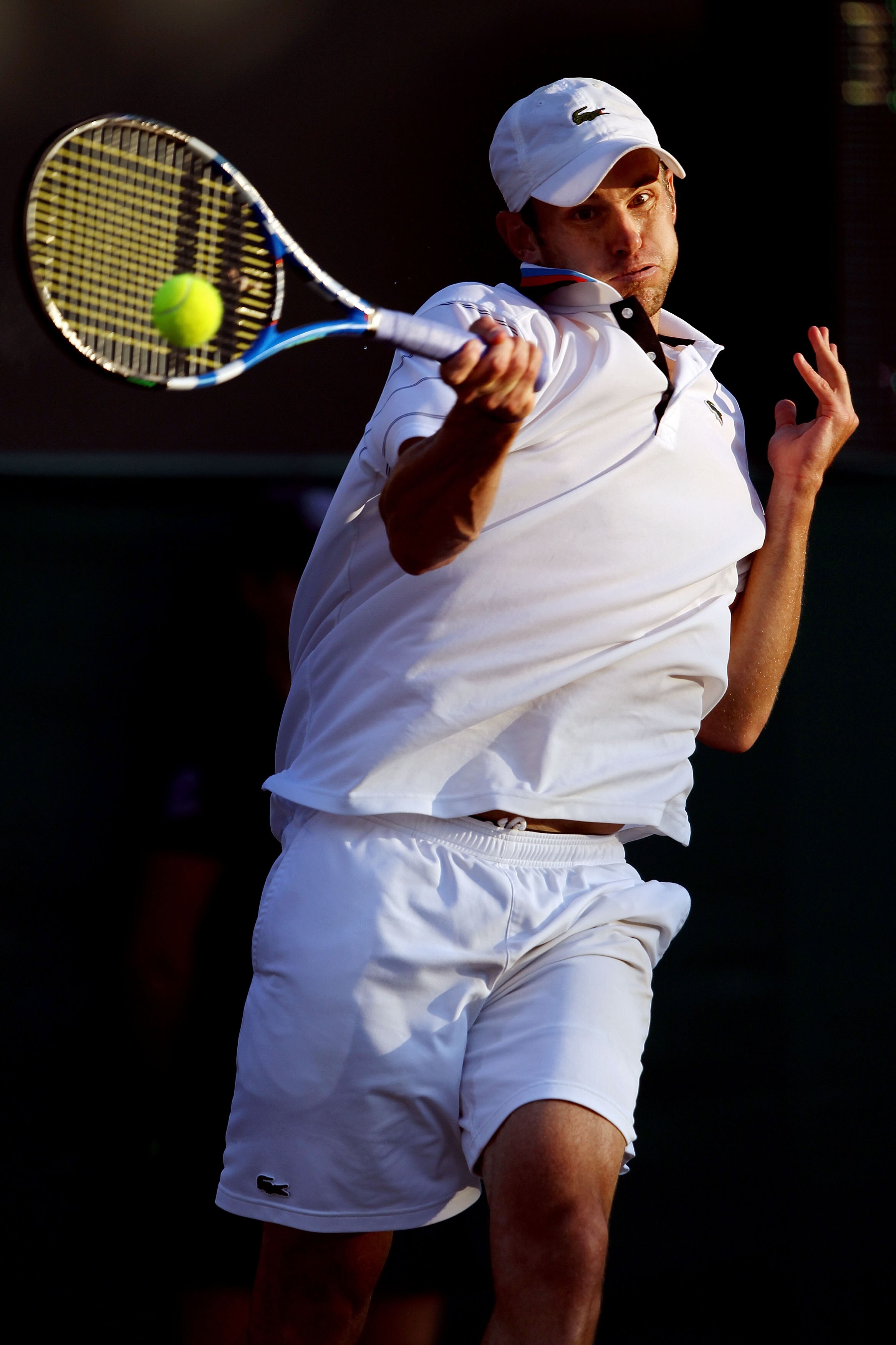 LONDON, ENGLAND - JUNE 28:  Andy Roddick of USA returns a shot against Yen-Hsun Lu of Taipei on Day Seven of the Wimbledon Lawn Tennis Championships at the All England Lawn Tennis and Croquet Club on June 28, 2010 in London, England.  (Photo by Clive Brun