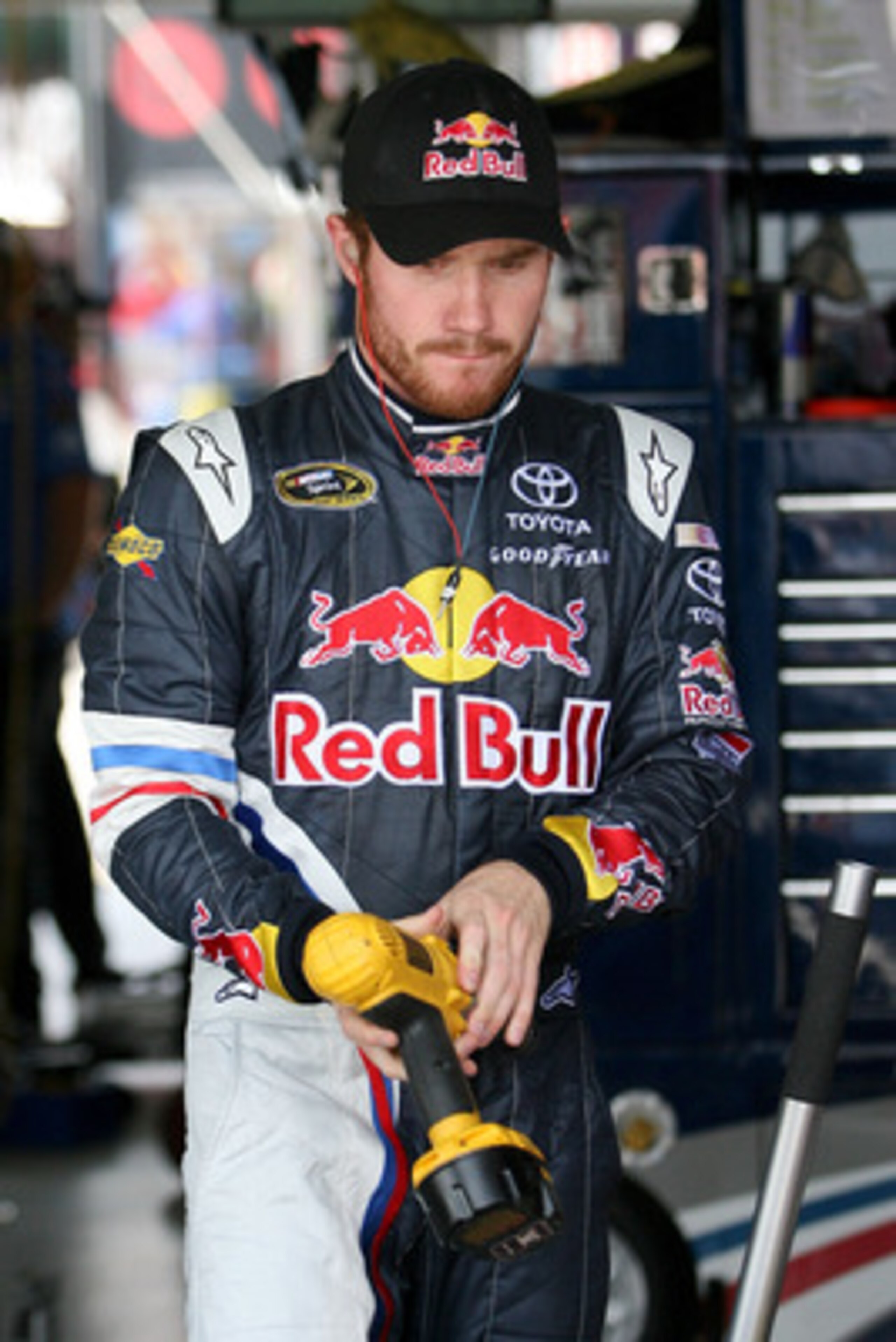KANSAS CITY, KS - JUNE 03:  Brian Vickers, driver of the #83 Red Bull Toyota, stands in the garage area during practice for the NASCAR Sprint Cup Series STP 400 at Kansas Speedway on June 3, 2011 in Kansas City, Kansas.  (Photo by Tim Umphrey/Getty Images
