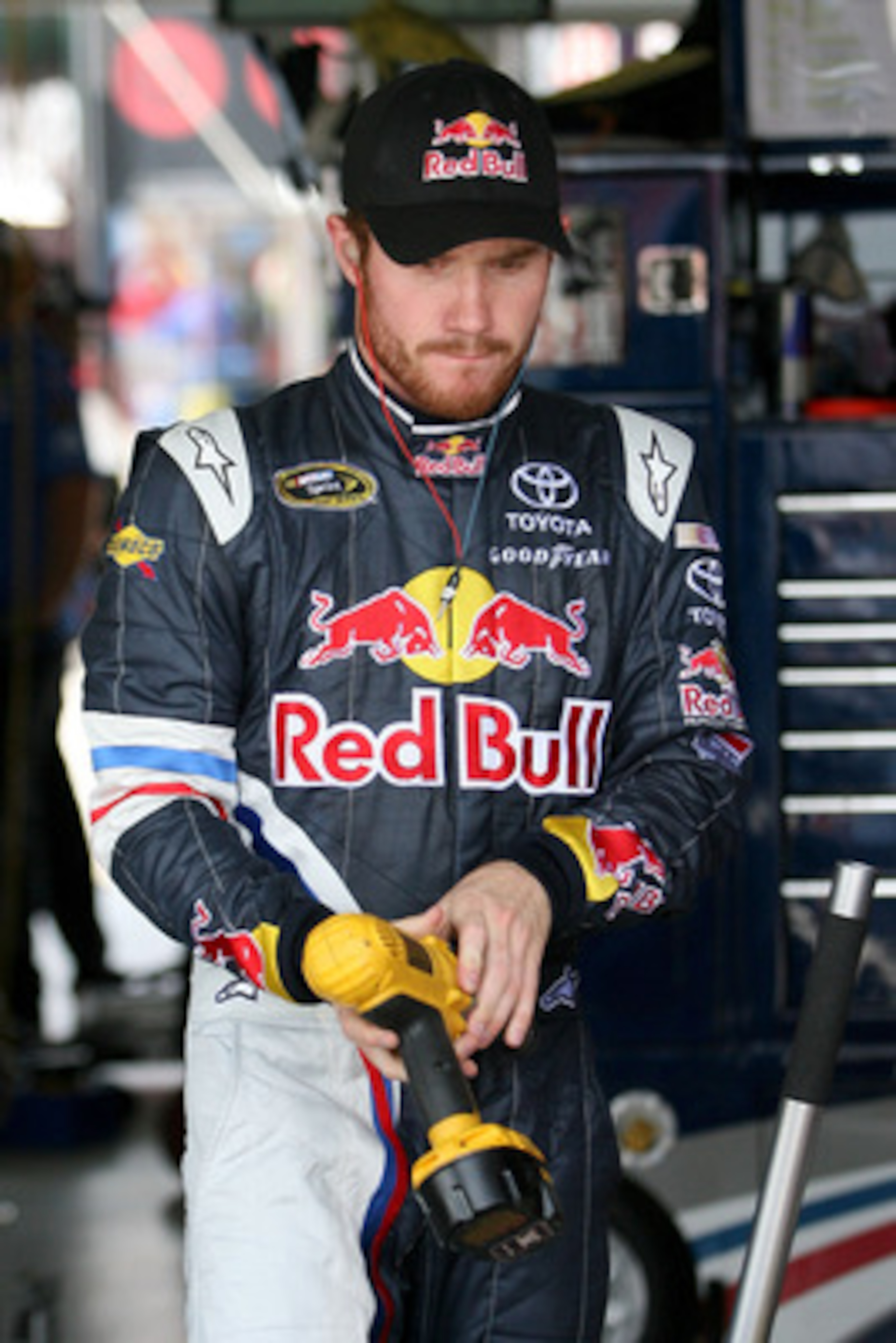 KANSAS CITY, KS - JUNE 03:  Brian Vickers, driver of the #83 Red Bull Toyota, stands in the garage area during practice for the NASCAR Sprint Cup Series STP 400 at Kansas Speedway on June 3, 2011 in Kansas City, Kansas.  (Photo by Tim Umphrey/Getty Images