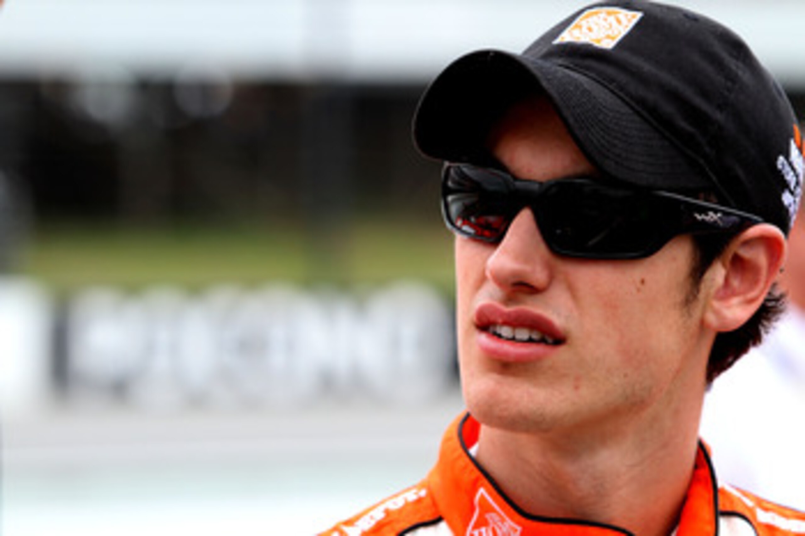 LONG POND, PA - JUNE 12:  Joey Logano, driver of the #20 The Home Depot Toyota, stands on the grid prior to the NASCAR Sprint Cup Series 5-Hour Energy 500 at Pocono Raceway on June 12, 2011 in Long Pond, Pennsylvania.  (Photo by Jerry Markland/Getty Image