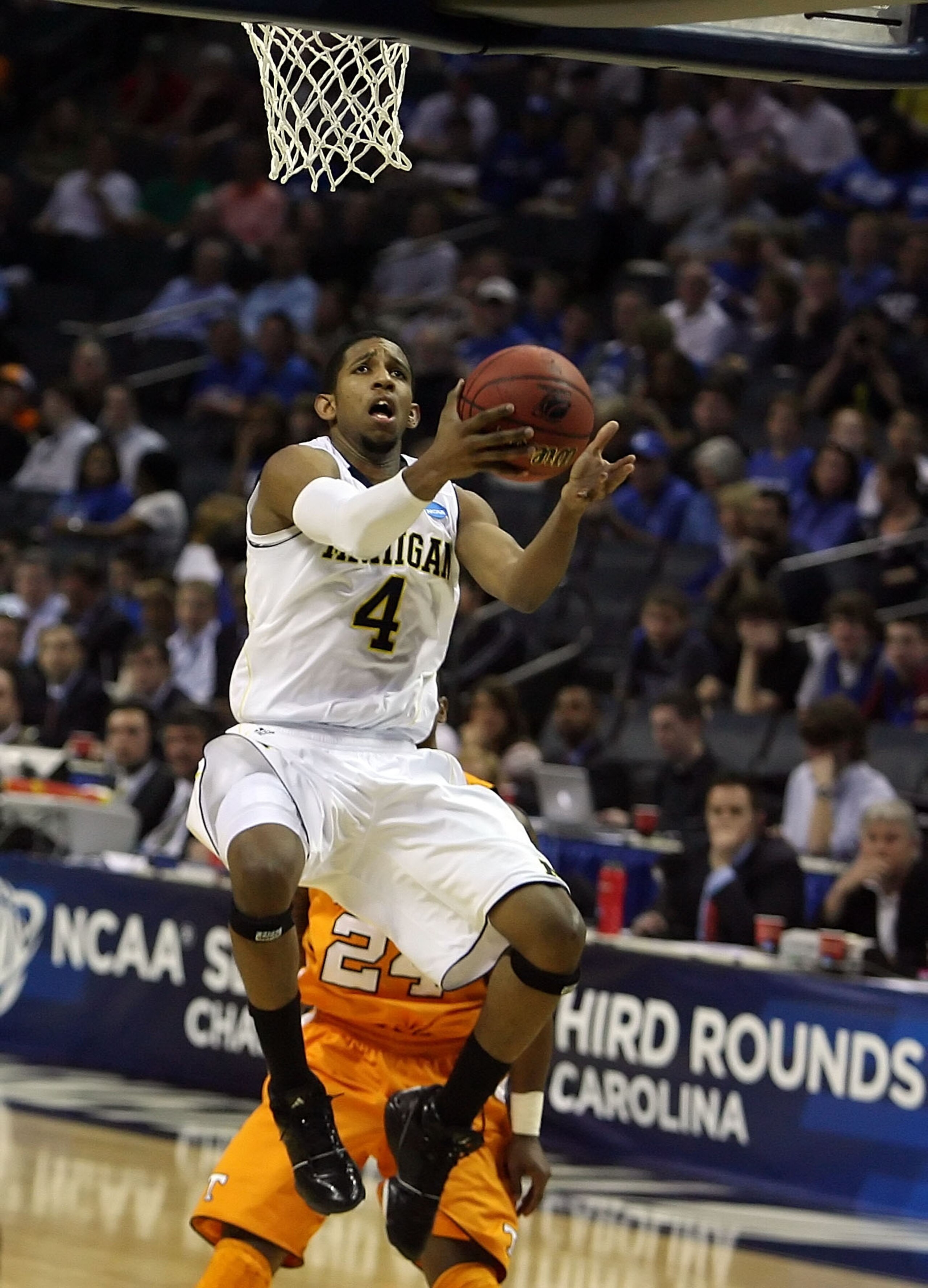 CHARLOTTE, NC - MARCH 18: Darius Morris #4 of the Michigan Wolverines lays the ball up in the second half while taking on the Tennessee Volunteers during the second round of the 2011 NCAA men's basketball tournament at Time Warner Cable Arena on March 18 CHARLOTTE, NC - MARCH 18: Darius Morris #4 of the Michigan Wolverines lays the ball up in the second half while taking on the Tennessee Volunteers during the second round of the 2011 NCAA men's basketball tournament at Time Warner Cable Arena on March 18