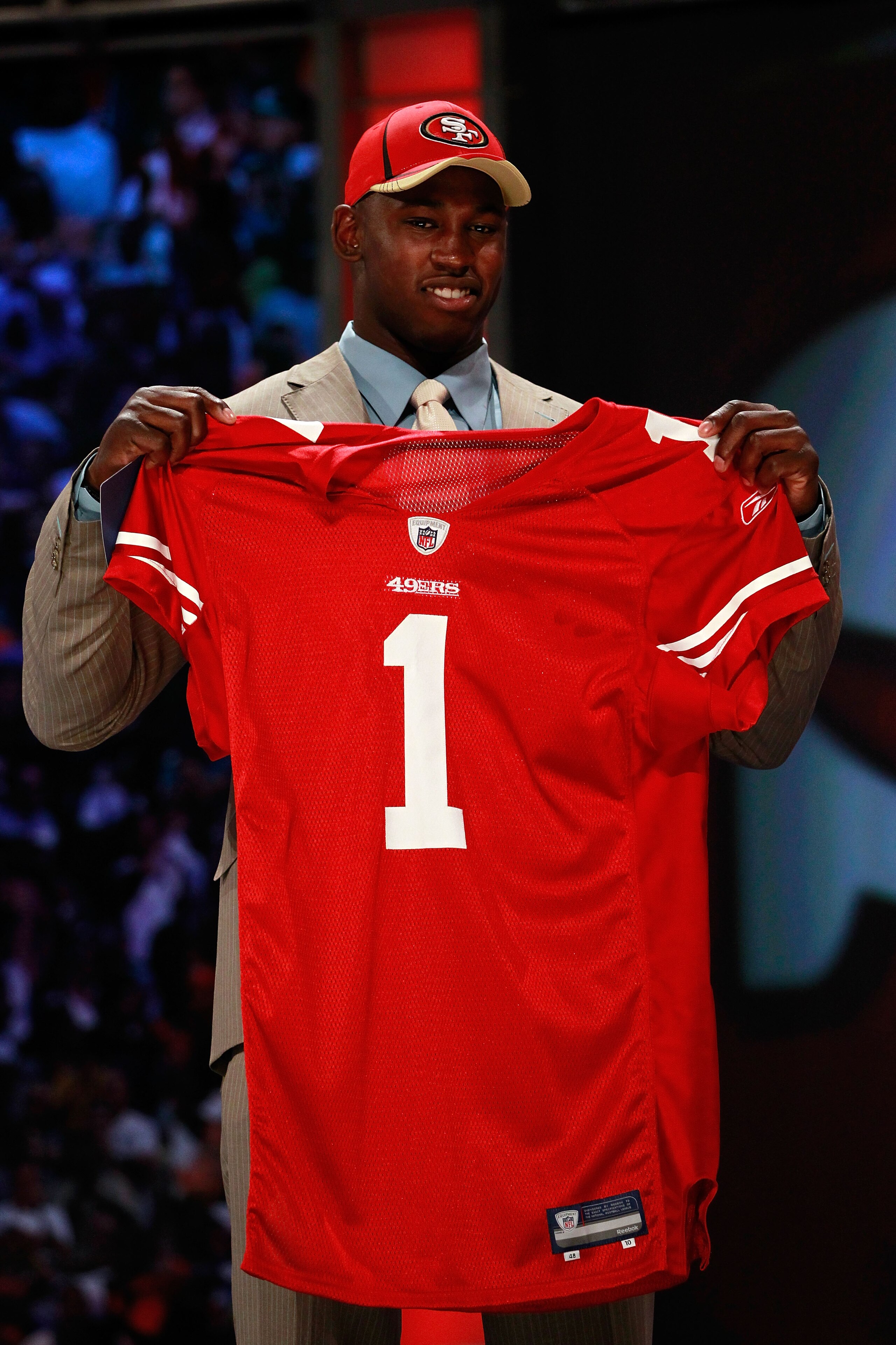 NEW YORK, NY - APRIL 28:  Aldon Smith, #7 overall pick by the San Francisco 49ers, holds up a jersey on stage during the 2011 NFL Draft at Radio City Music Hall on April 28, 2011 in New York City.  (Photo by Chris Trotman/Getty Images)
