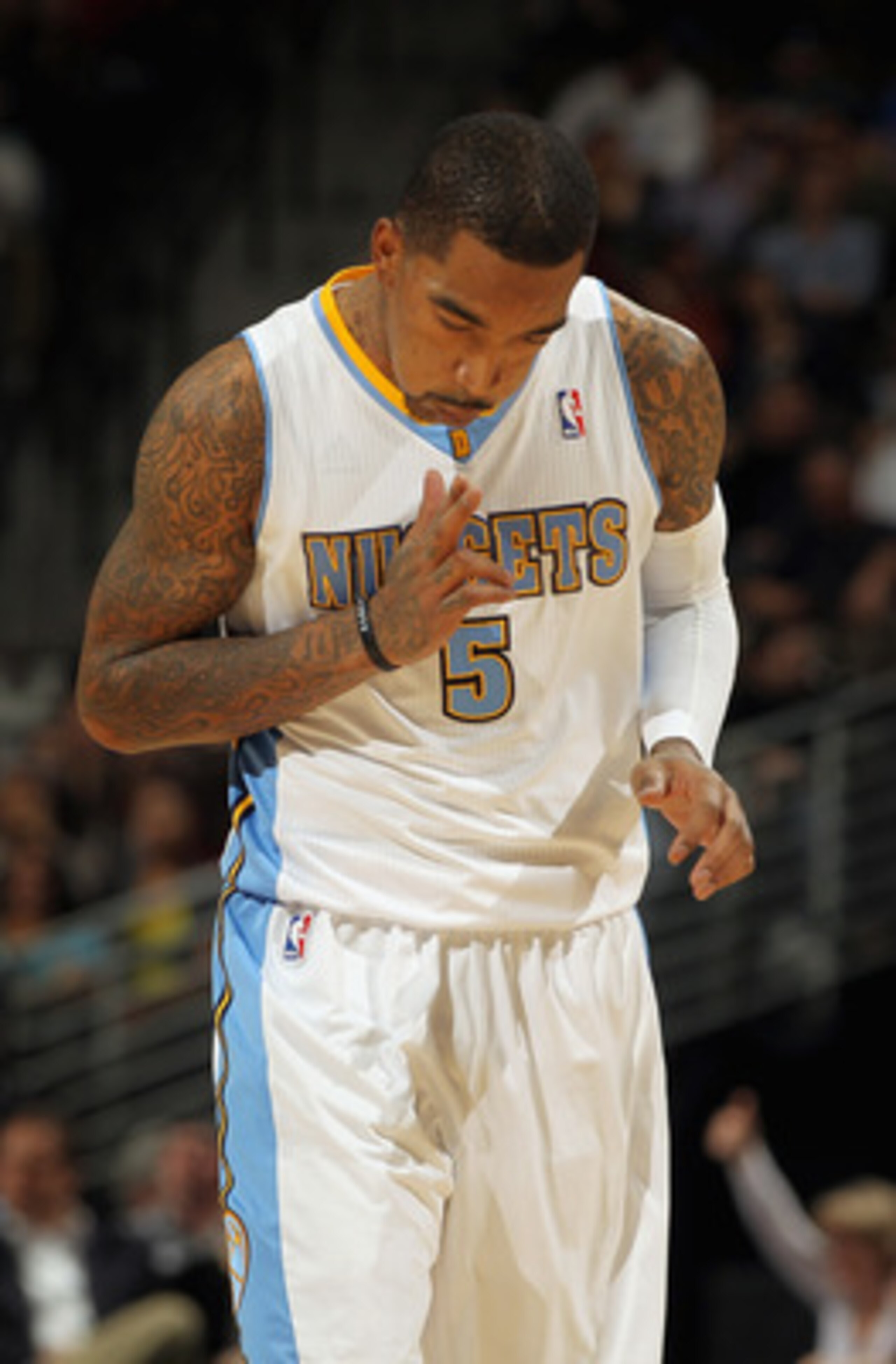 DENVER, CO - MARCH 02:  J.R. Smith #5 of the Denver Nuggets celebrates after scoring against the Charlotte Bobcats at the Pepsi Center on March 2, 2011 in Denver, Colorado. The Nuggets defeated the Bobcats 120-80.NOTE TO USER: User expressly acknowledges 