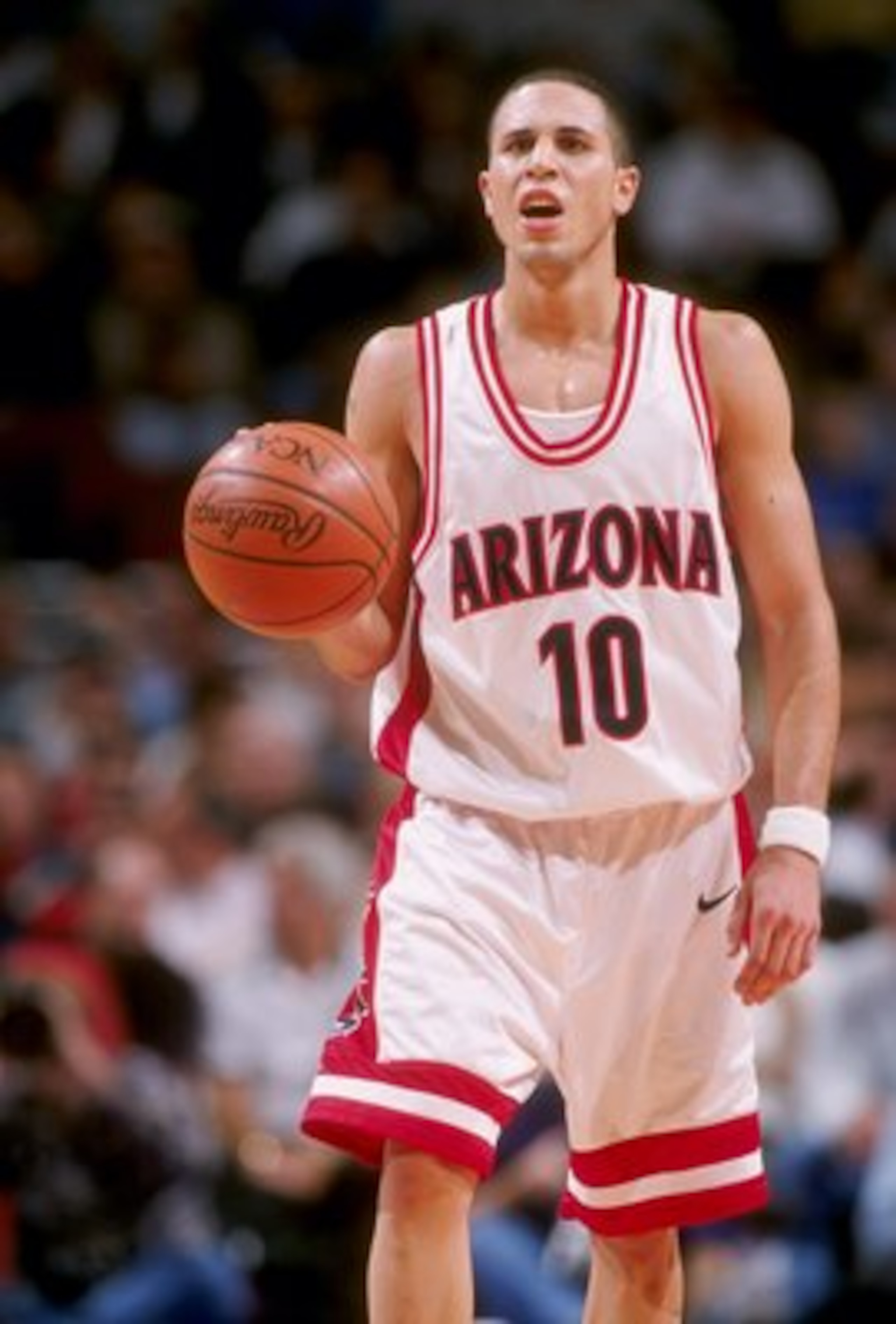 2 Dec 1997: Guard Mike Bibby of the Arizona Wildcats moves the ball during a game against the Kansas Jayhawks at the United Center in Chicago, Illinois. Kansas won the game, 90-87. Mandatory Credit: Jonathan Daniel /Allsport 2 Dec 1997: Guard Mike Bibby of the Arizona Wildcats moves the ball during a game against the Kansas Jayhawks at the United Center in Chicago, Illinois. Kansas won the game, 90-87. Mandatory Credit: Jonathan Daniel /Allsport