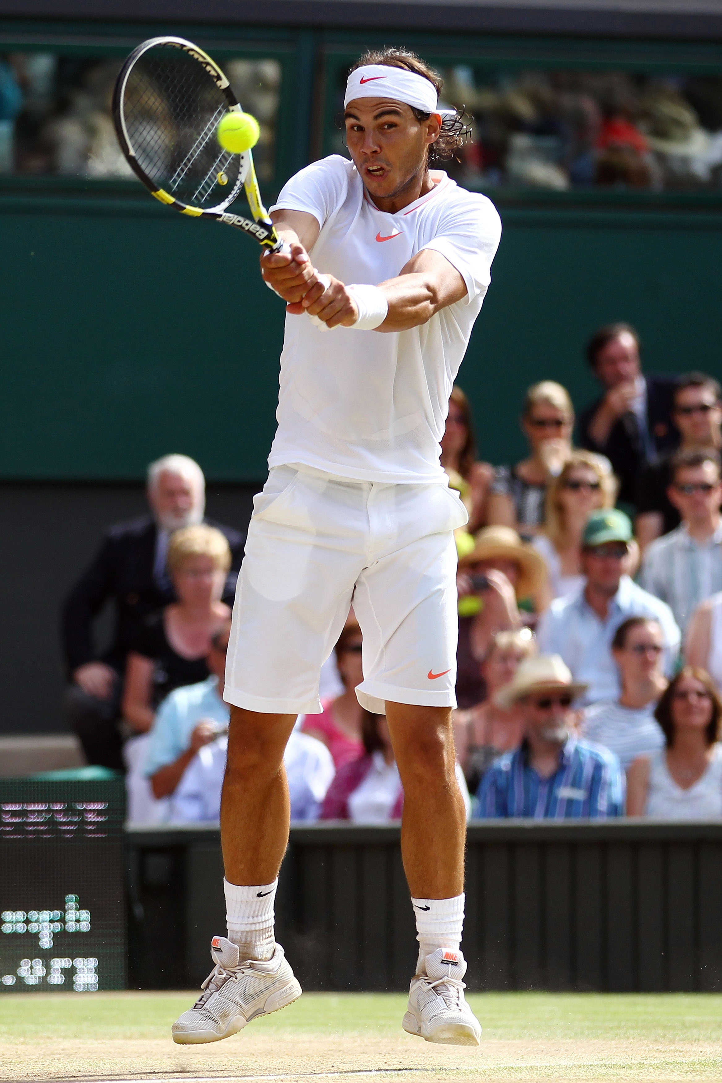 LONDON, ENGLAND - JULY 04:  Rafael Nadal of Spain plays a shot during the Men's Singles Final match against Tomas Berdych of Czech Republic on Day Thirteen of the Wimbledon Lawn Tennis Championships at the All England Lawn Tennis and Croquet Club on July