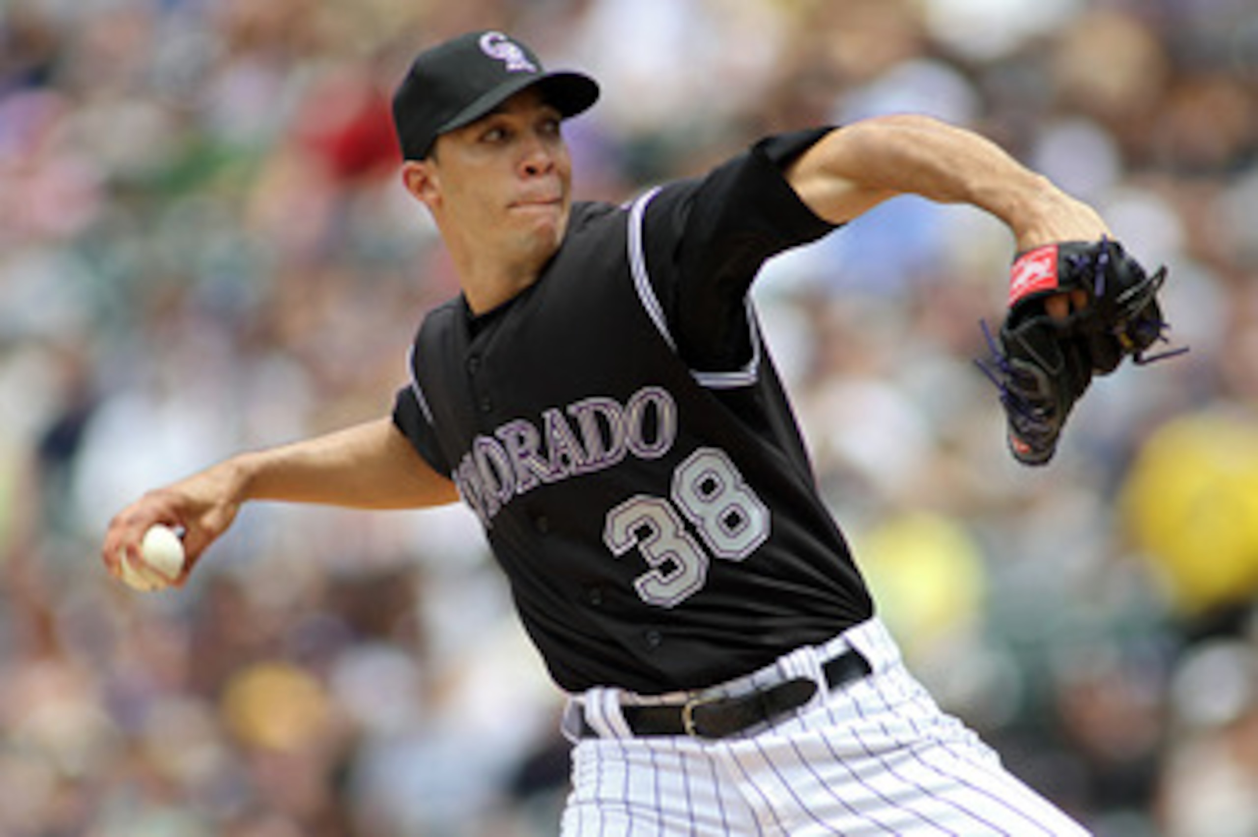 DENVER, CO - JUNE 12: Ubaldo Jimenez #38 of the Colorado Rockies pitches against the Los Angeles Dodgers on June 12, 2011 at Coors Field in Denver, Colorado. Jimenez has gotten off to a slow start in 2011 going 1-7 after winning 19 games last season. (Pho