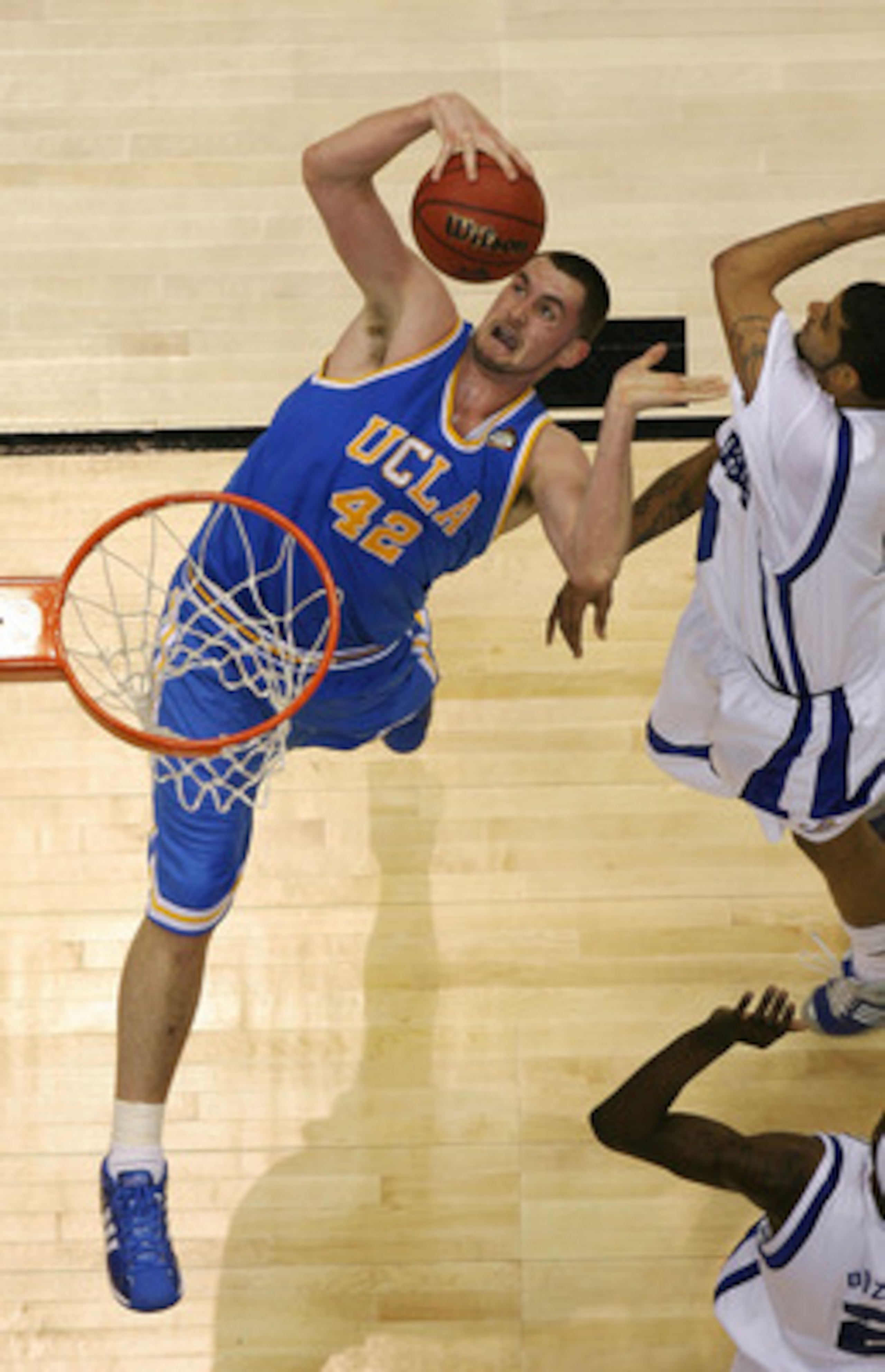SAN ANTONIO - APRIL 05: Kevin Love #42 of the UCLA Bruins pulls in a rebound against the Memphis Tigers during the National Semifinal game of the NCAA Men's Final Four at the Alamodome on April 5, 2008 in San Antonio, Texas. (Photo by Streeter Lecka/Get SAN ANTONIO - APRIL 05: Kevin Love #42 of the UCLA Bruins pulls in a rebound against the Memphis Tigers during the National Semifinal game of the NCAA Men's Final Four at the Alamodome on April 5, 2008 in San Antonio, Texas. (Photo by Streeter Lecka/Get