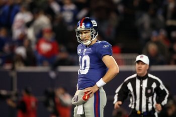 EAST RUTHERFORD, NJ - DECEMBER 13:  Eli Manning #10 of the New York Giants looks on against the Philadelphia Eagles at Giants Stadium on December 13, 2009 in East Rutherford, New Jersey.  (Photo by Nick Laham/Getty Images)