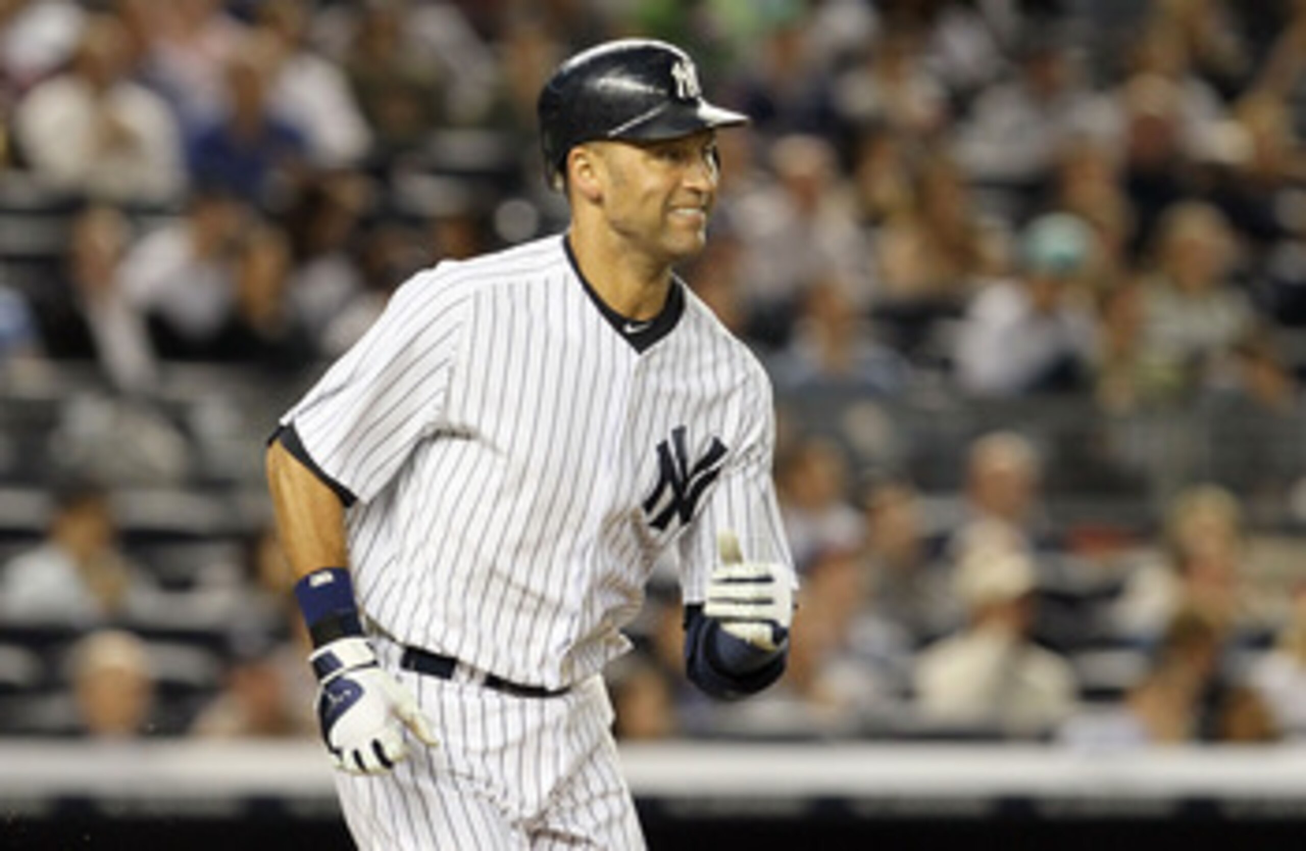 NEW YORK, NY - JUNE 13:  Derek Jeter #2 of the New York Yankees grimaces as he flies out in the fifth inning against the Cleveland Indians on June 13, 2011 at Yankee Stadium in the Bronx borough of New York City. Jeter suffered a sore right calf on the pl