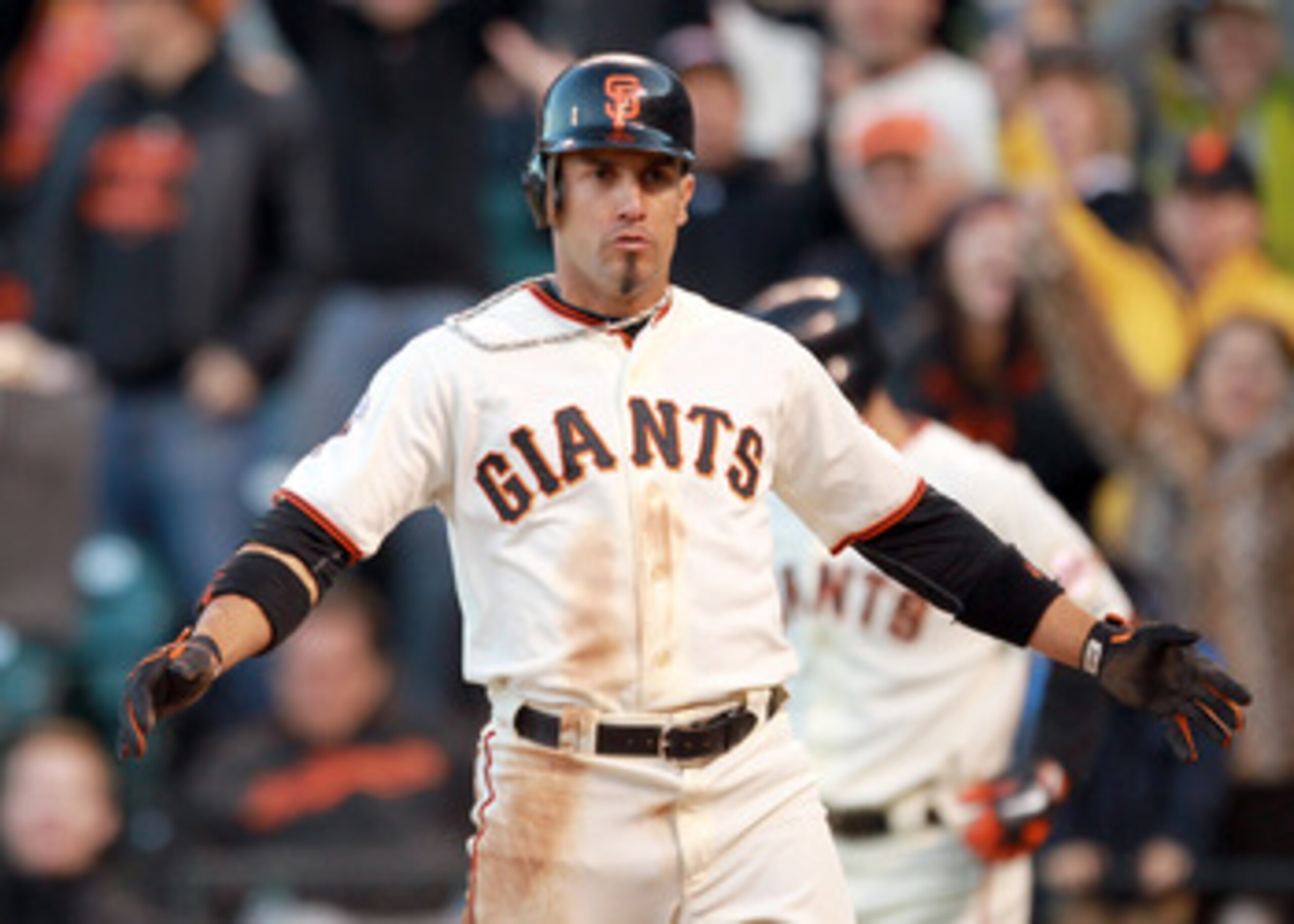 SAN FRANCISCO, CA - JUNE 12:  Andres Torres #56 of the San Francisco Giants walks back to the dugout after he scored to put the Giants ahead 4-2 in the seventh inning against the Cincinnati Reds at AT&T Park on June 12, 2011 in San Francisco, California. 