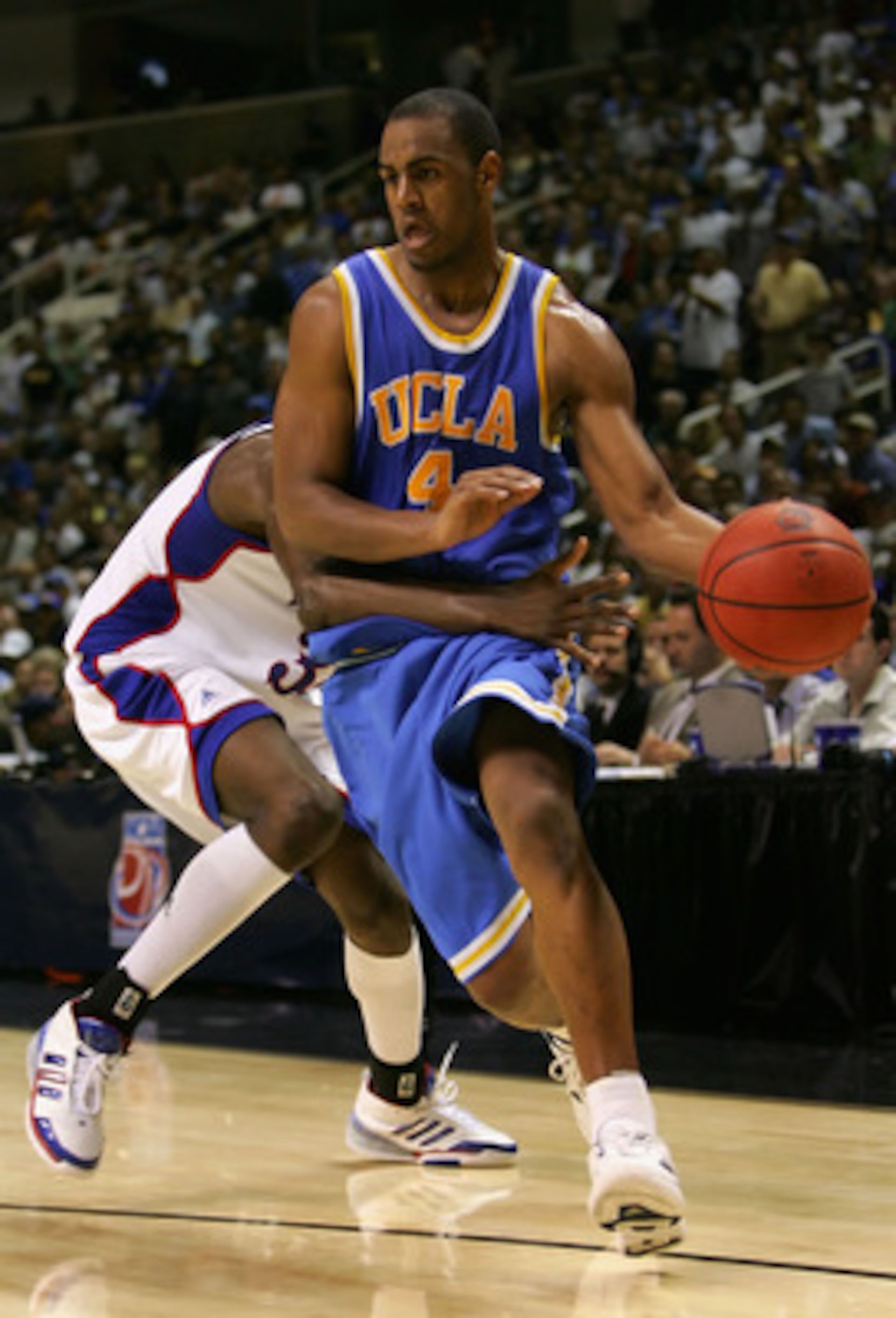 SAN JOSE, CA - MARCH 24: Arron Afflalo #4 of the UCLA Bruins drives the ball against the Kansas Jayhawks during the west regional final of the NCAA Men's Basketball Tournament at the HP Pavilion on March 24, 2007 in San Jose, California. The Bruins defea SAN JOSE, CA - MARCH 24: Arron Afflalo #4 of the UCLA Bruins drives the ball against the Kansas Jayhawks during the west regional final of the NCAA Men's Basketball Tournament at the HP Pavilion on March 24, 2007 in San Jose, California. The Bruins defea