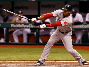 ST PETERSBURG, FL - JUNE 14: Outfielder Carl Crawford #13 of the Boston Red Sox fouls off a pitch against the Tampa Bay Rays during the game at Tropicana Field on June 14, 2011 in St. Petersburg, Florida. (Photo by J. Meric/Getty Images) ST PETERSBURG, FL - JUNE 14: Outfielder Carl Crawford #13 of the Boston Red Sox fouls off a pitch against the Tampa Bay Rays during the game at Tropicana Field on June 14, 2011 in St. Petersburg, Florida. (Photo by J. Meric/Getty Images)