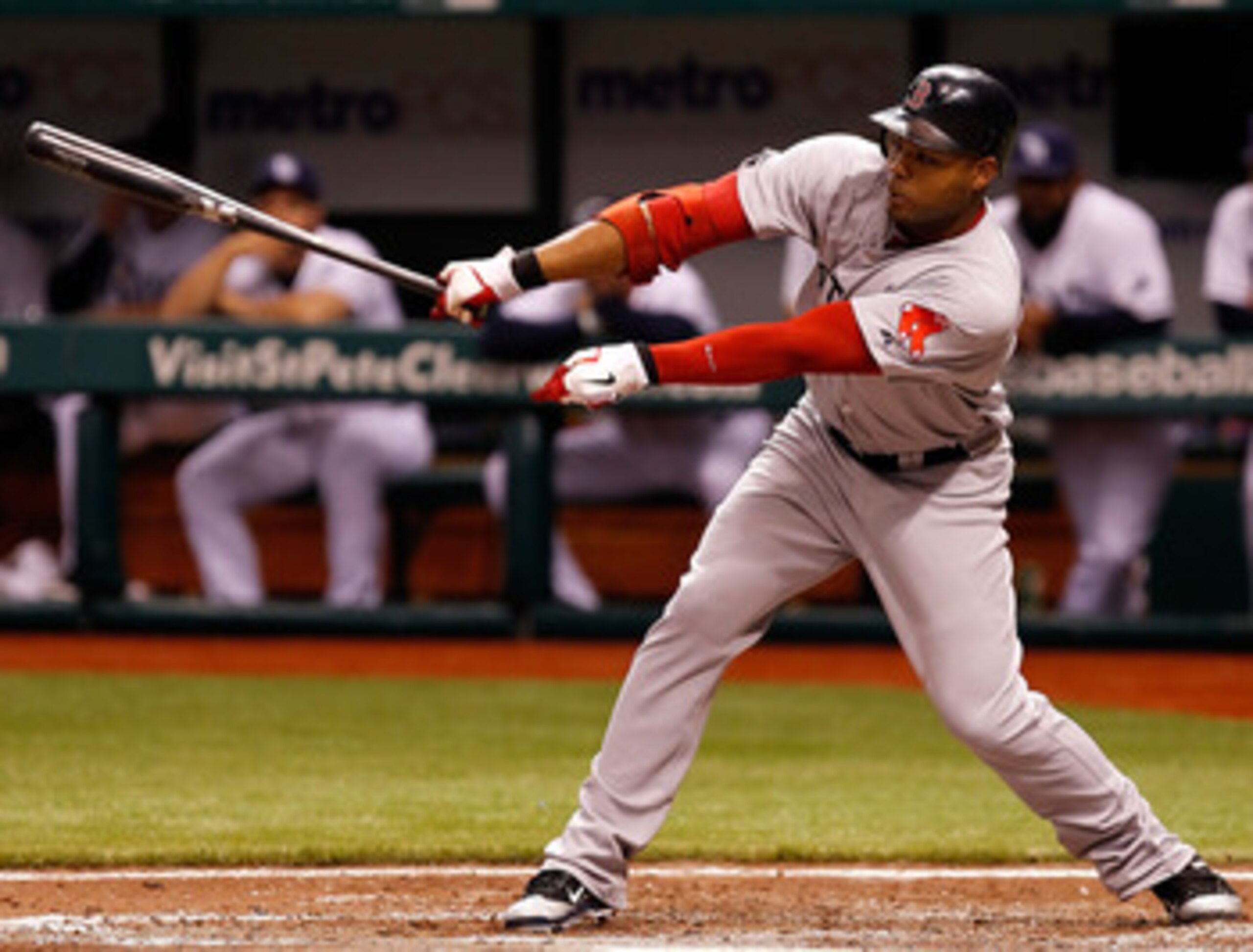 ST PETERSBURG, FL - JUNE 14: Outfielder Carl Crawford #13 of the Boston Red Sox fouls off a pitch against the Tampa Bay Rays during the game at Tropicana Field on June 14, 2011 in St. Petersburg, Florida. (Photo by J. Meric/Getty Images) ST PETERSBURG, FL - JUNE 14: Outfielder Carl Crawford #13 of the Boston Red Sox fouls off a pitch against the Tampa Bay Rays during the game at Tropicana Field on June 14, 2011 in St. Petersburg, Florida. (Photo by J. Meric/Getty Images)