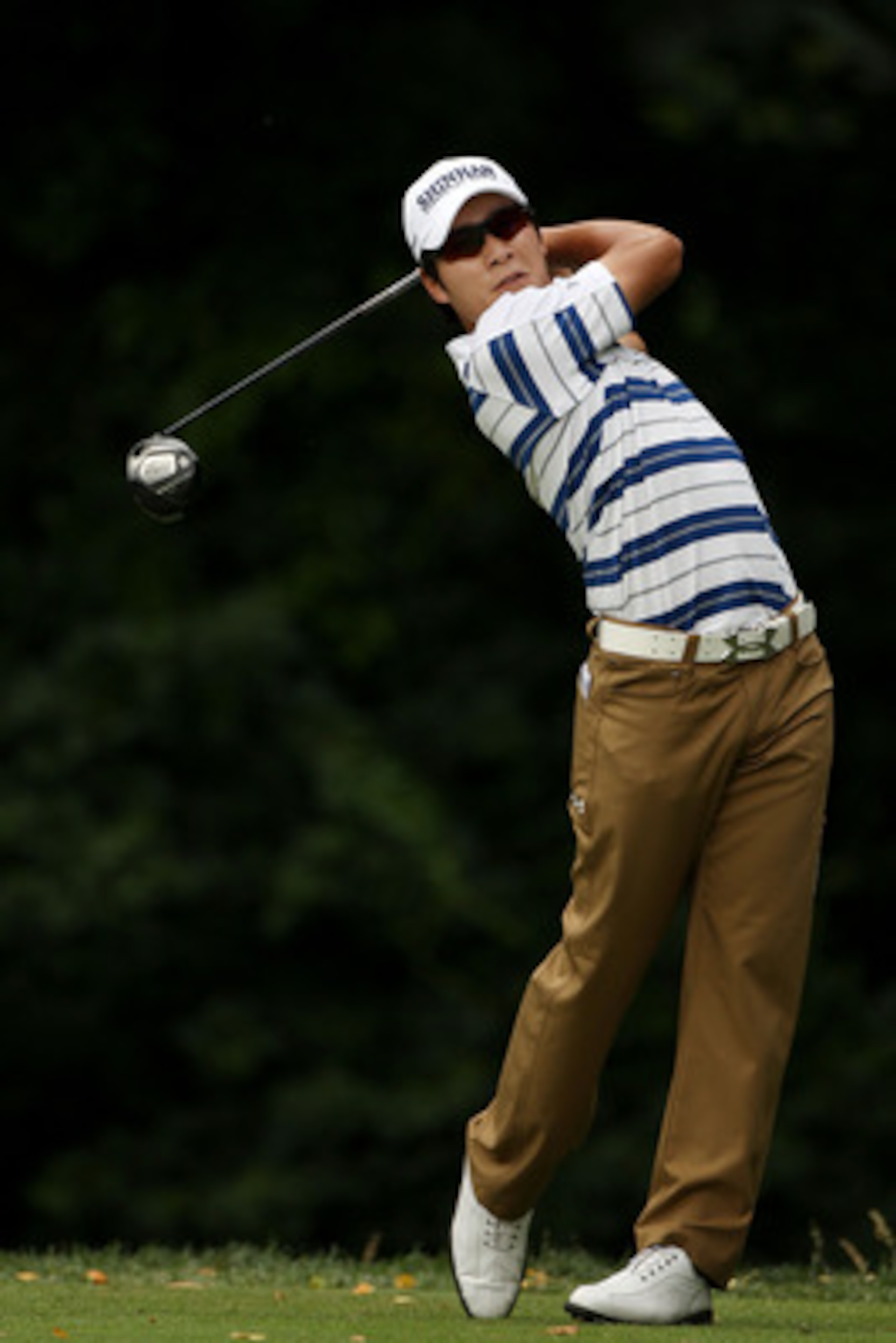 BETHESDA, MD - JUNE 16:  Kyung-Tae Kim of South Korea watches his tee shot on the 11th hole during the first round of the 111th U.S. Open at Congressional Country Club on June 16, 2011 in Bethesda, Maryland.  (Photo by Andrew Redington/Getty Images)