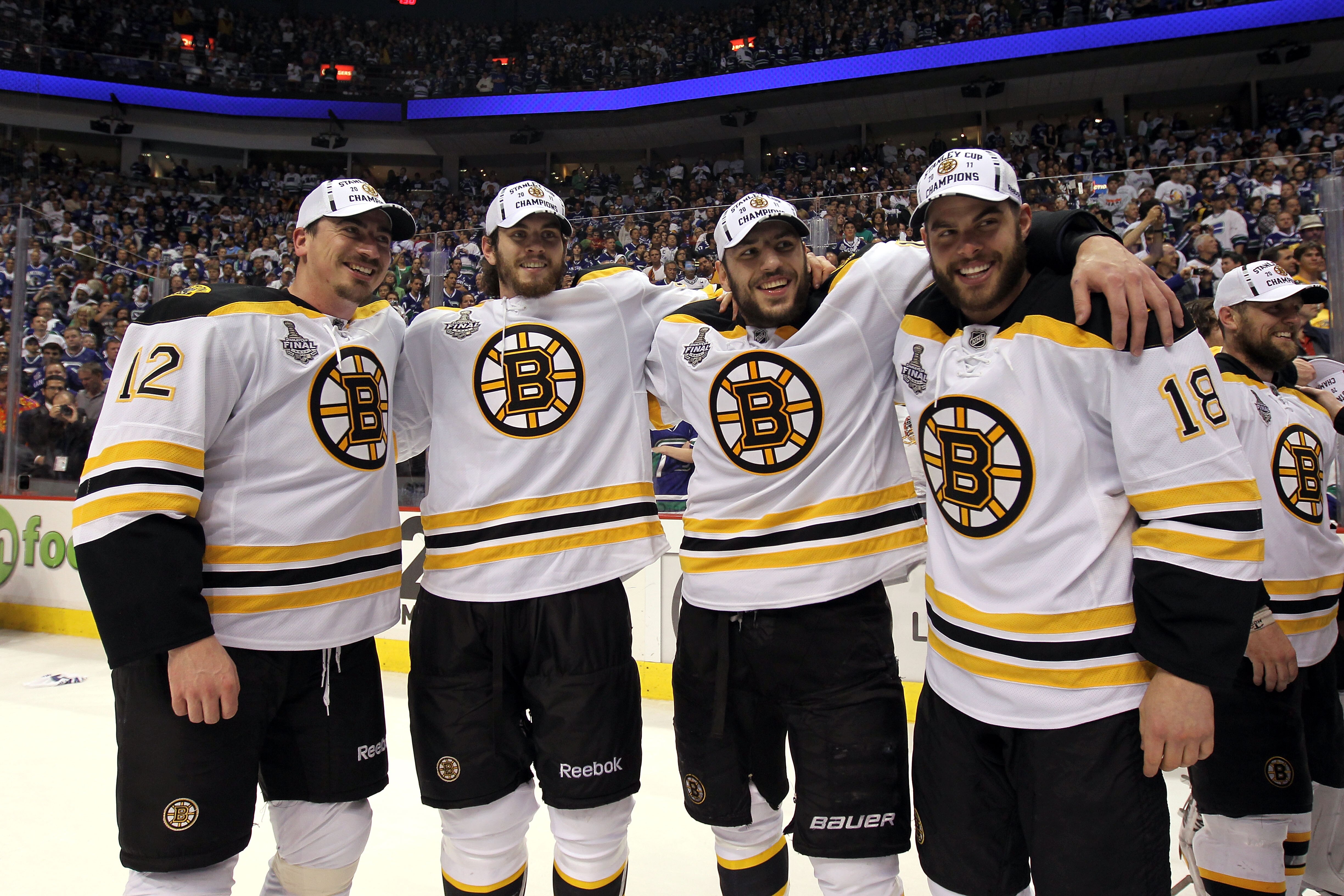 VANCOUVER, BC - JUNE 15:  (L-R) Tomas Kaberle #12, Adam McQuaid #54, Milan Lucic #17 and Nathan Horton #18 of the Boston Bruins celebrates winning the Stanley Cup after defeating the Vancouver Canucks in Game Seven of the 2011 NHL Stanley Cup Final at Rog