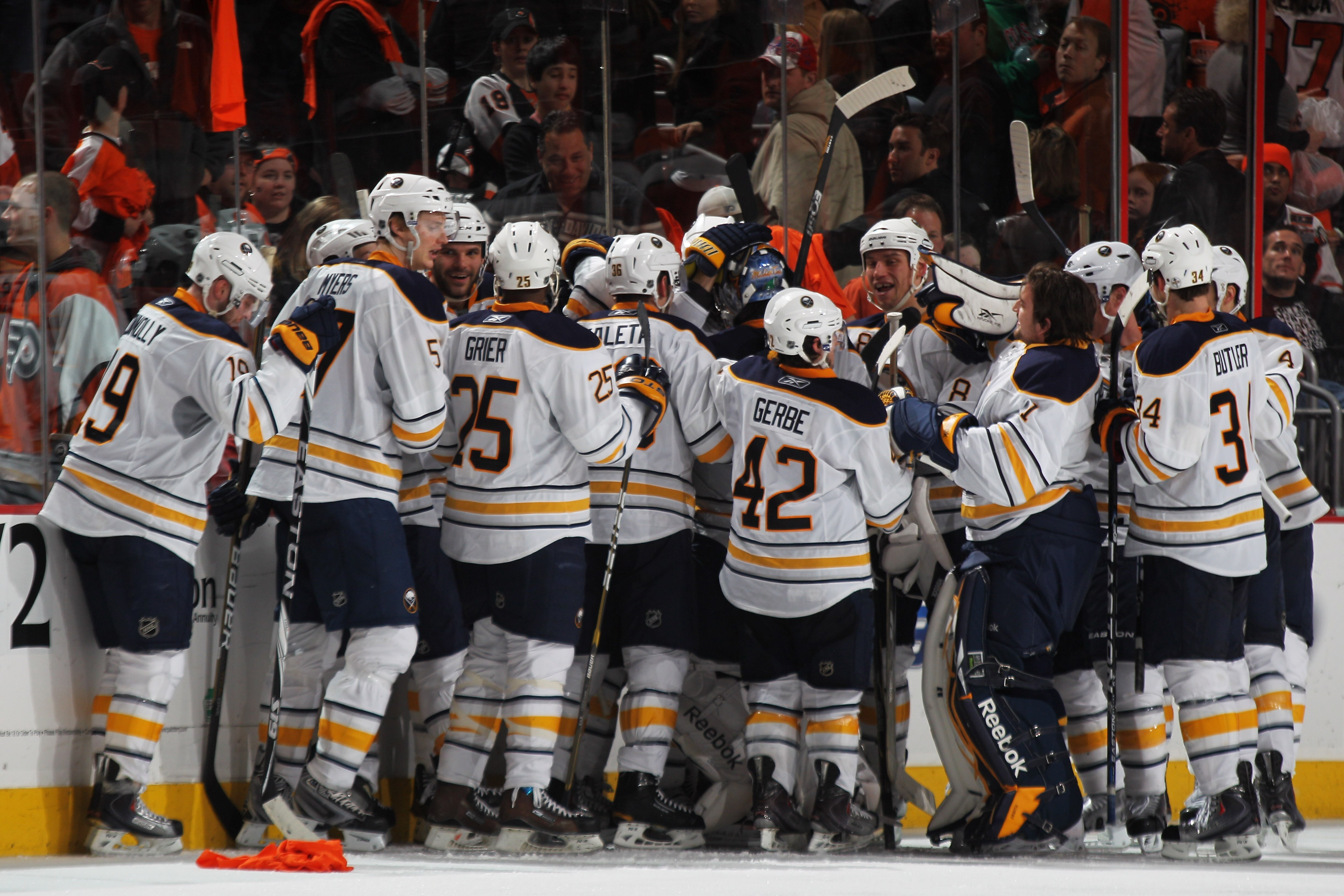 PHILADELPHIA, PA - APRIL 22:  Tyler Ennis #63 of the Buffalo Sabres celebrates with teammates after scoring the game winning goal in overtime in Game Five of the Eastern Conference Quarterfinals during the 2011 NHL Stanley Cup Playoffs at Wells Fargo Cent