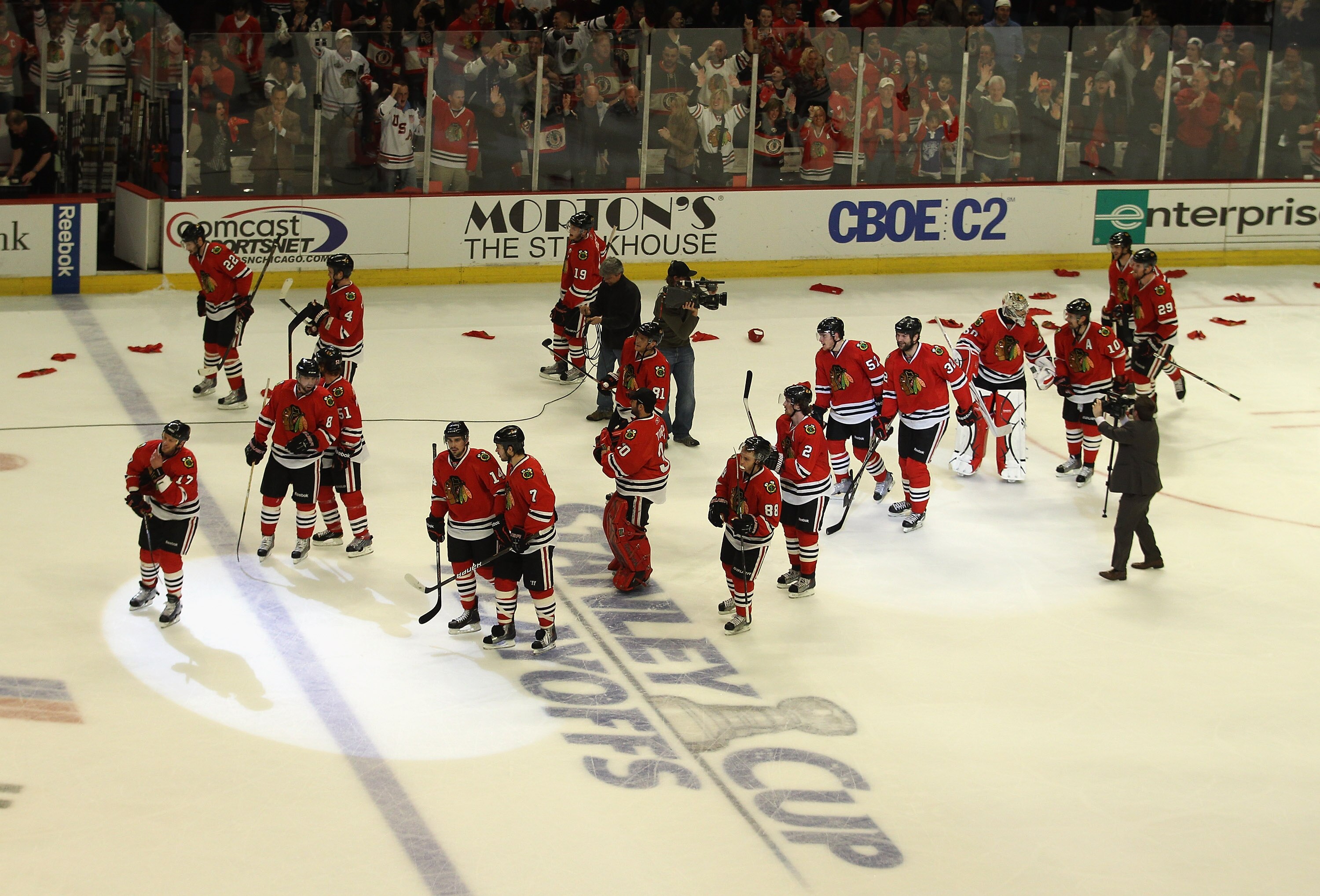 CHICAGO, IL - APRIL 24: Members of the Chicago Blackhawks celebrate a win over the Vancouver Canucks in Game Six of the Western Conference Quarterfinals during the 2011 NHL Stanley Cup Playoffs at the United Center on April 24, 2011 in Chicago, Illinois.