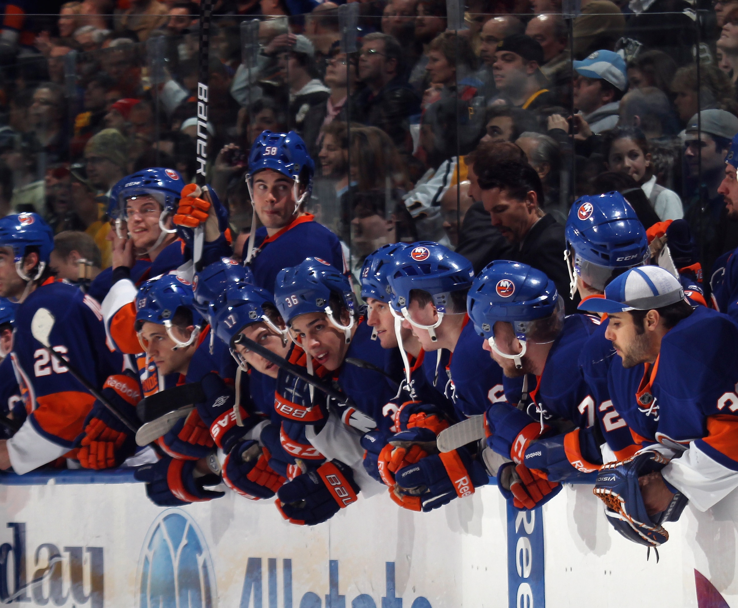 UNIONDALE, NY - APRIL 08:  The New York Islanders watch the shoot out against the Pittsburgh Penguins with their helmets on backwards for good luck at the Nassau Coliseum on April 8, 2011 in Uniondale, New York.  (Photo by Bruce Bennett/Getty Images)