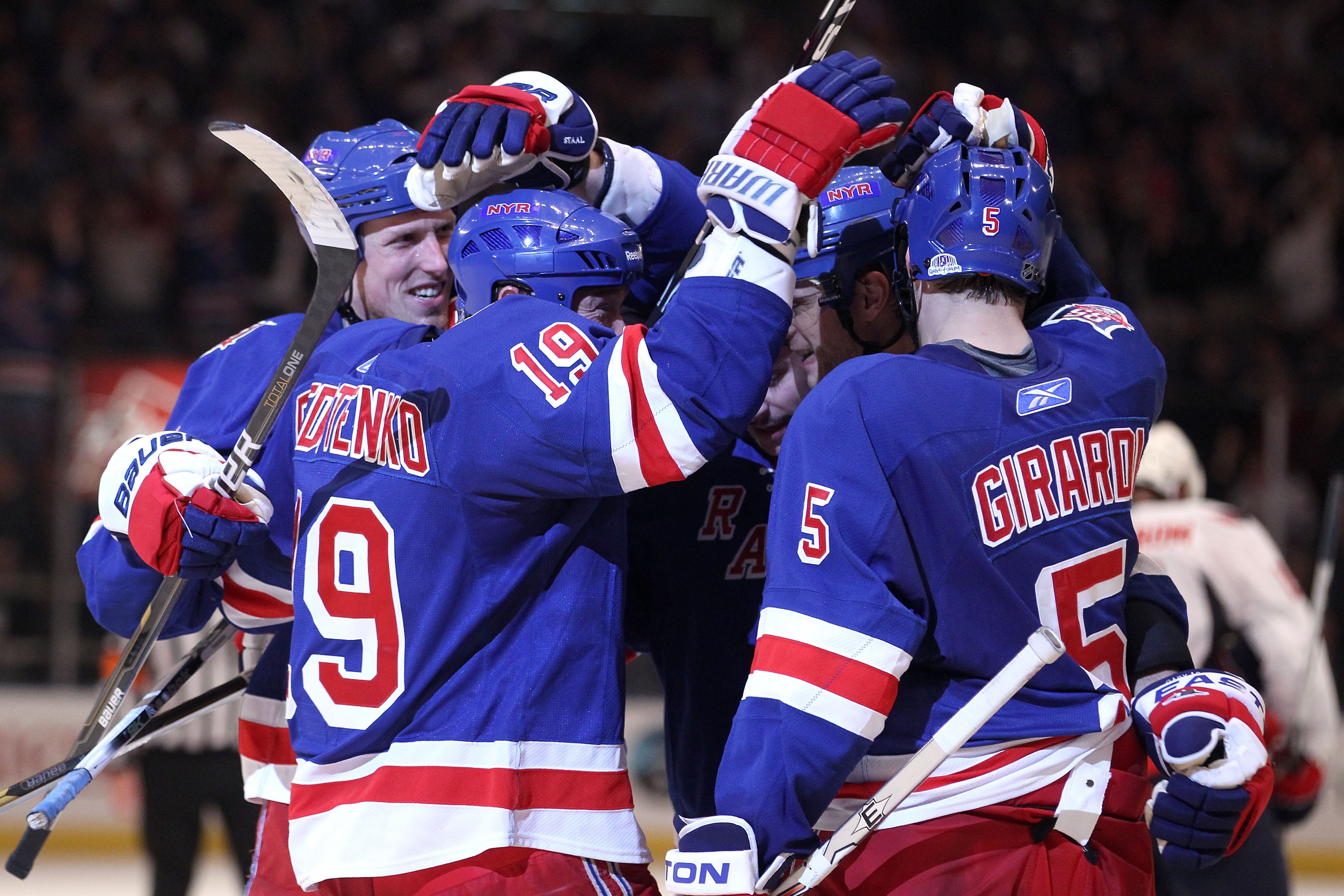 NEW YORK, NY - APRIL 20:  The New York Rangers celebrate after Brandon Dubinsky #17 scored a second period goal against the Washington Capitals skates off in Game Four of the Eastern Conference Quarterfinals during the 2011 NHL Stanley Cup Playoffs at Mad