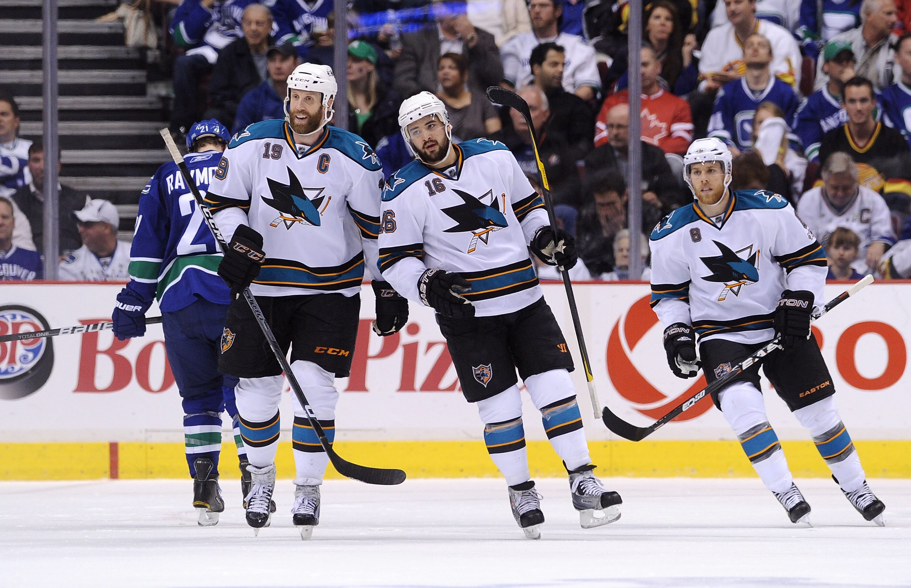 VANCOUVER, CANADA - MAY 24:  (L-R) Joe Thornton #19, Devin Setoguchi #16 and Joe Pavelski #8 of the San Jose Sharks look to celebrate the goal by teammate Patrick Marleau #12 (not in photo)  in Game Five of the Western Conference Finals against the Vancou