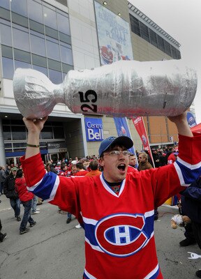 MONTREAL, CANADA - APRIL 18:  Jean-Francois Boudreau celebrates with other fans before Game Three of the Eastern Conference Quarterfinals between the Boston Bruins and the Montreal Canadiens during the 2011 NHL Stanley Cup Playoffs at the Bell Centre on A