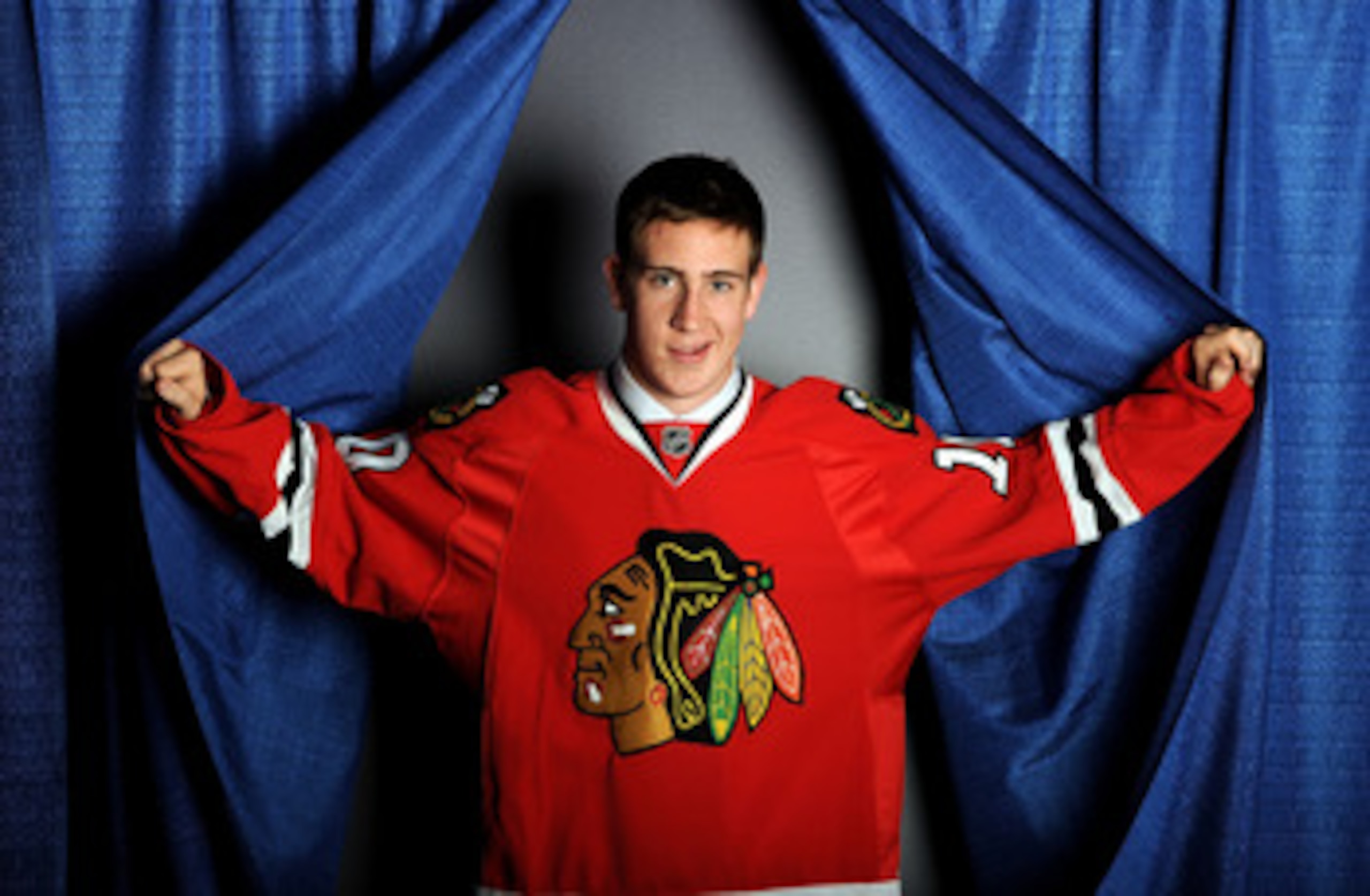 LOS ANGELES, CA - JUNE 25:  Kevin Hayes, drafted 24th overall by the Chicago Blackhawks, poses on stage during the 2010 NHL Entry Draft at Staples Center on June 25, 2010 in Los Angeles, California.  (Photo by Harry How/Getty Images)
