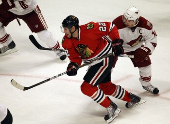 CHICAGO, IL - FEBRUARY 27: Troy Brouwer #22 of the Chicago Blackhawks skates past Shane Doan #19 of the Phoenix Coyotes at the United Center on February 27, 2011 in Chicago, Illinois. The Blackhawks defeated the Coyotes 4-3 in a shootout. (Photo by Jonath