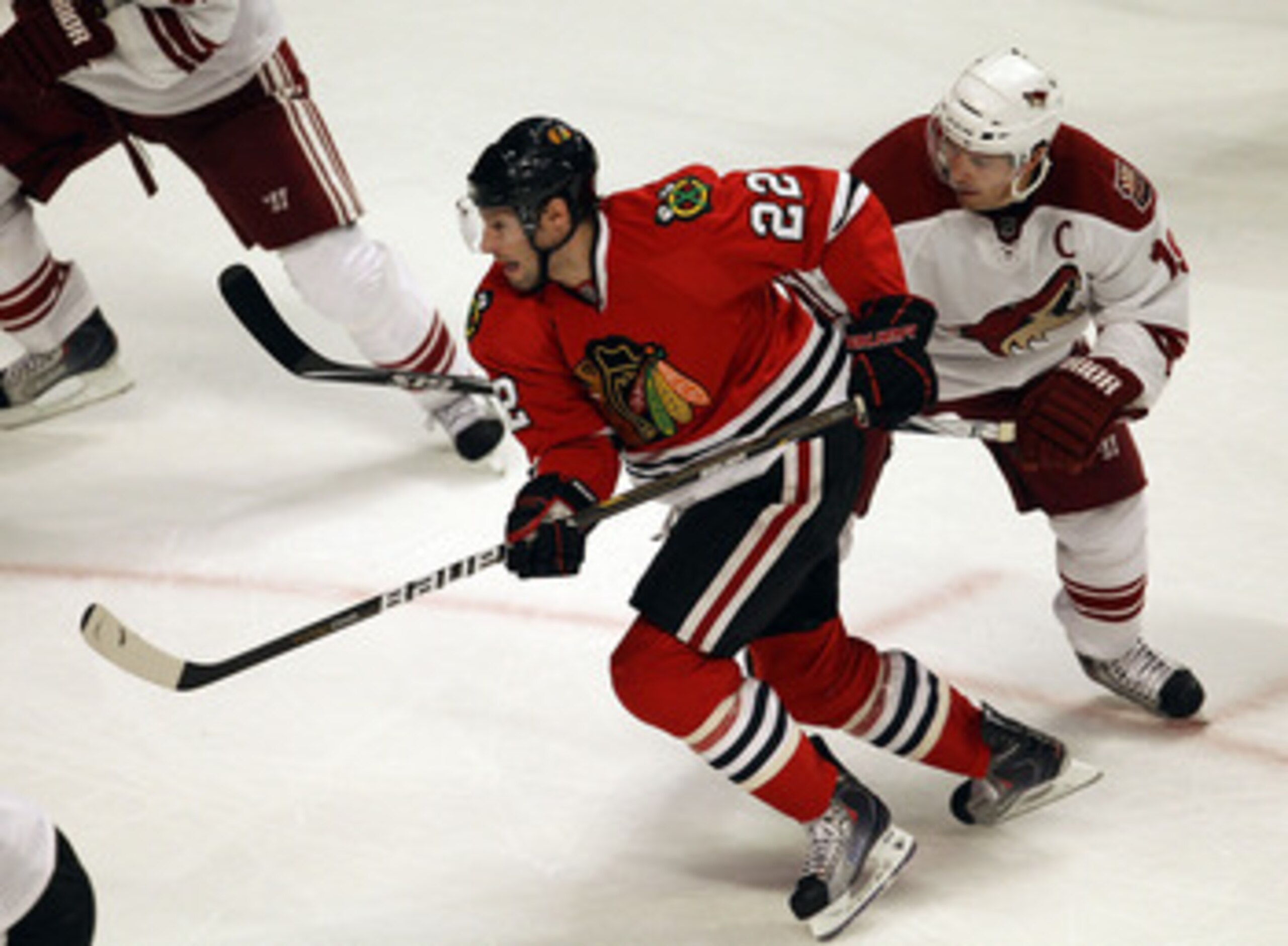 CHICAGO, IL - FEBRUARY 27: Troy Brouwer #22 of the Chicago Blackhawks skates past Shane Doan #19 of the Phoenix Coyotes at the United Center on February 27, 2011 in Chicago, Illinois. The Blackhawks defeated the Coyotes 4-3 in a shootout. (Photo by Jonath
