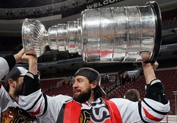 PHILADELPHIA - JUNE 09:  Adam Burish #37 of the Chicago Blackhawks hoists the Stanley Cup after teammate Patrick Kane scored the game-winning goal in overtime to defeat the Philadelphia Flyers 4-3 and win the Stanley Cup in Game Six of the 2010 NHL Stanle