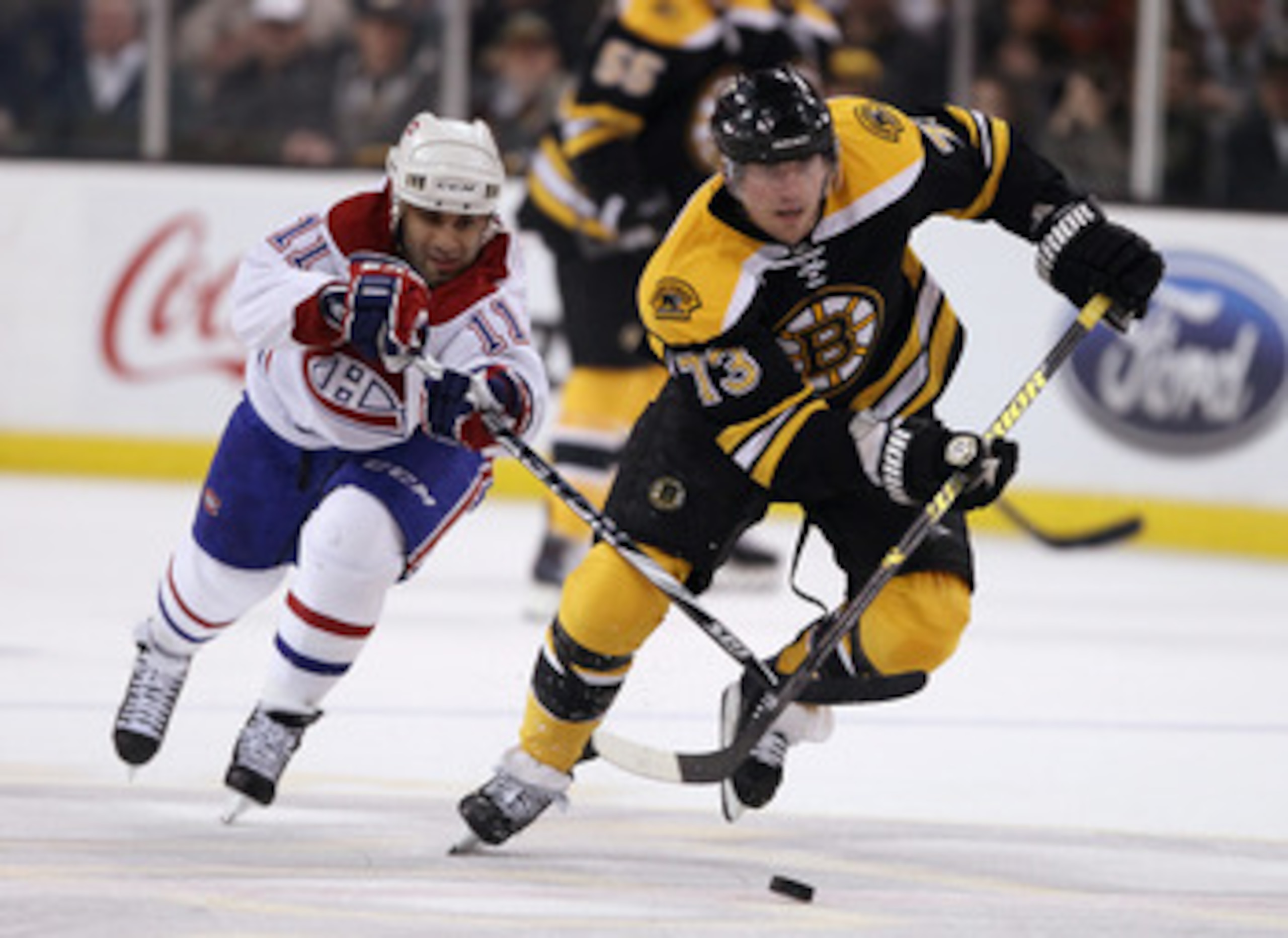 BOSTON, MA - APRIL 16:  Michael Ryder #73 of the Boston Bruins heads for the net as Scott Gomez #11 of the Montreal Canadiens defends in Game Two of the Eastern Conference Quarterfinals during the 2011 NHL Stanley Cup Playoffs at TD Garden on April 16, 20
