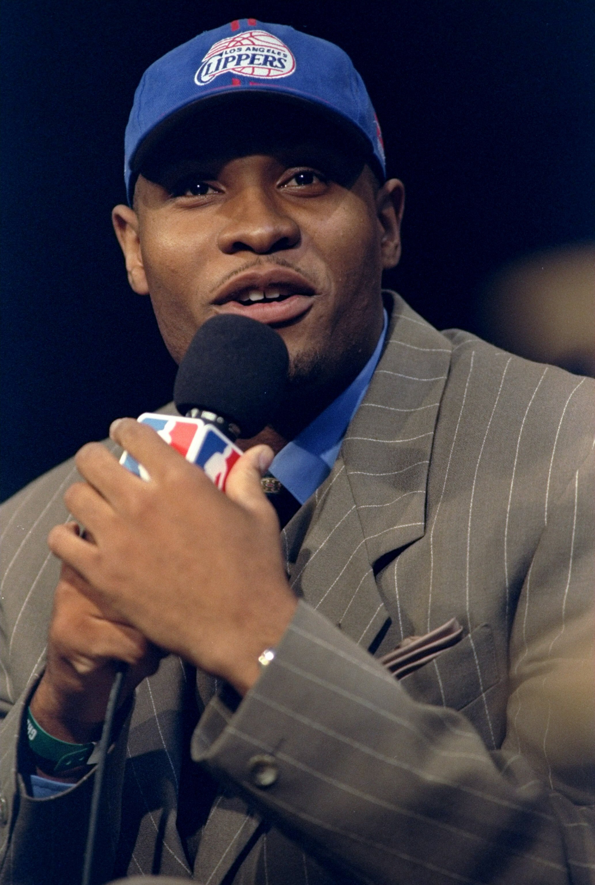24 Jun 1998: A picture of the 1st Pick Michael Olowokandi by the Los Angeles Clippers speaking in a microphone during the NBA Draft at the General Motors Palace in Vancouver, Canada. FOR EDITORIAL USE ONLY