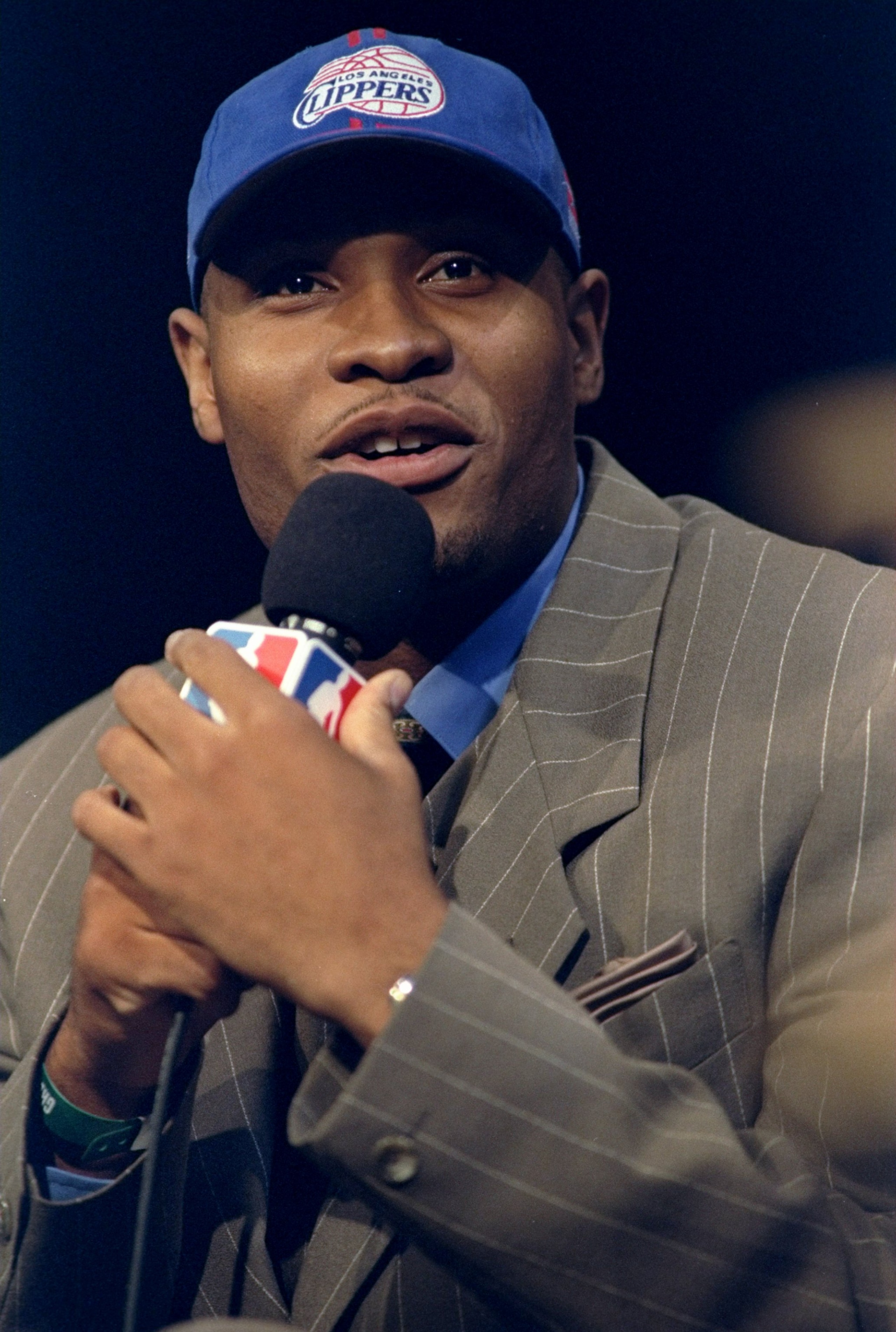 24 Jun 1998: A picture of the 1st Pick Michael Olowokandi by the Los Angeles Clippers speaking in a microphone during the NBA Draft at the General Motors Palace in Vancouver, Canada. FOR EDITORIAL USE ONLY